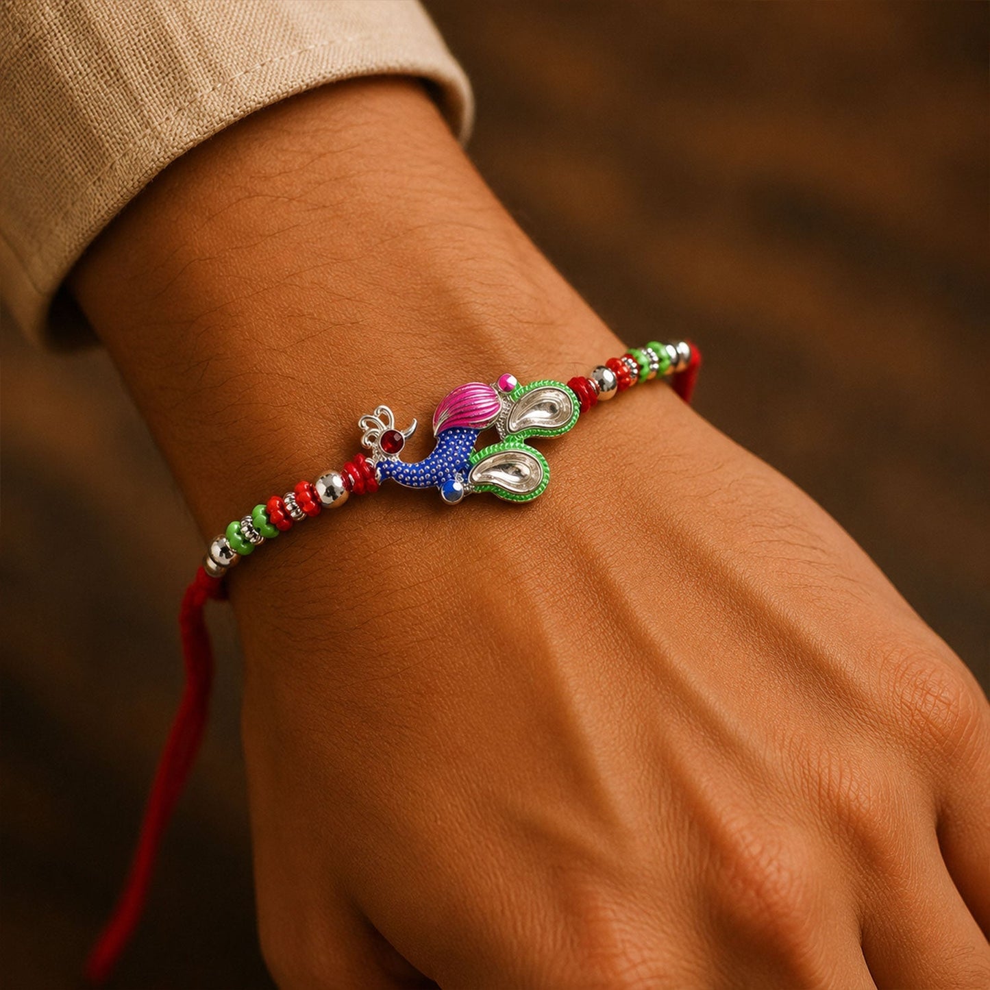 Designer peacock Rakhi with intricate multicolor stone design