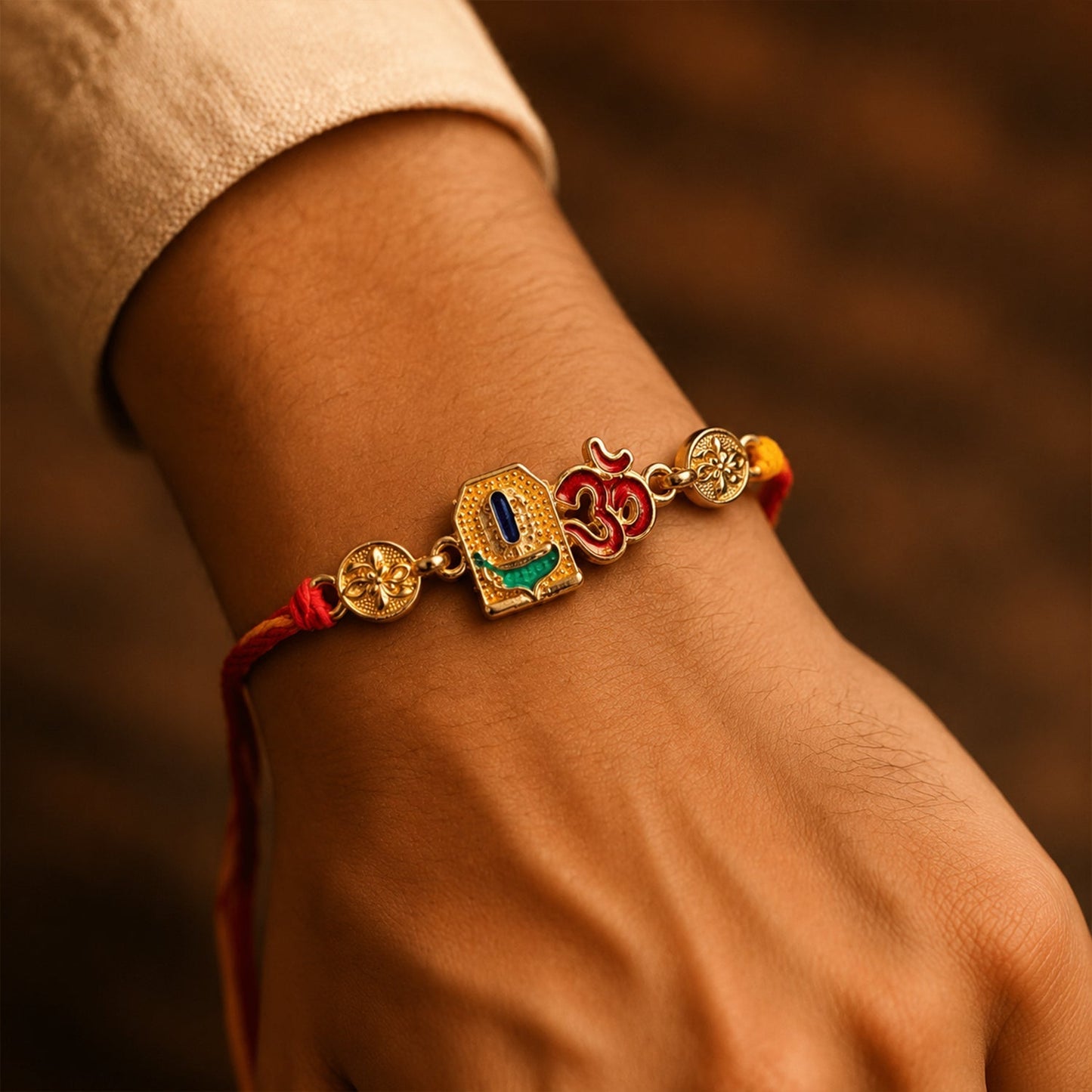 Stylish Om Blue Enamel Rakhi with vibrant blue and gold details