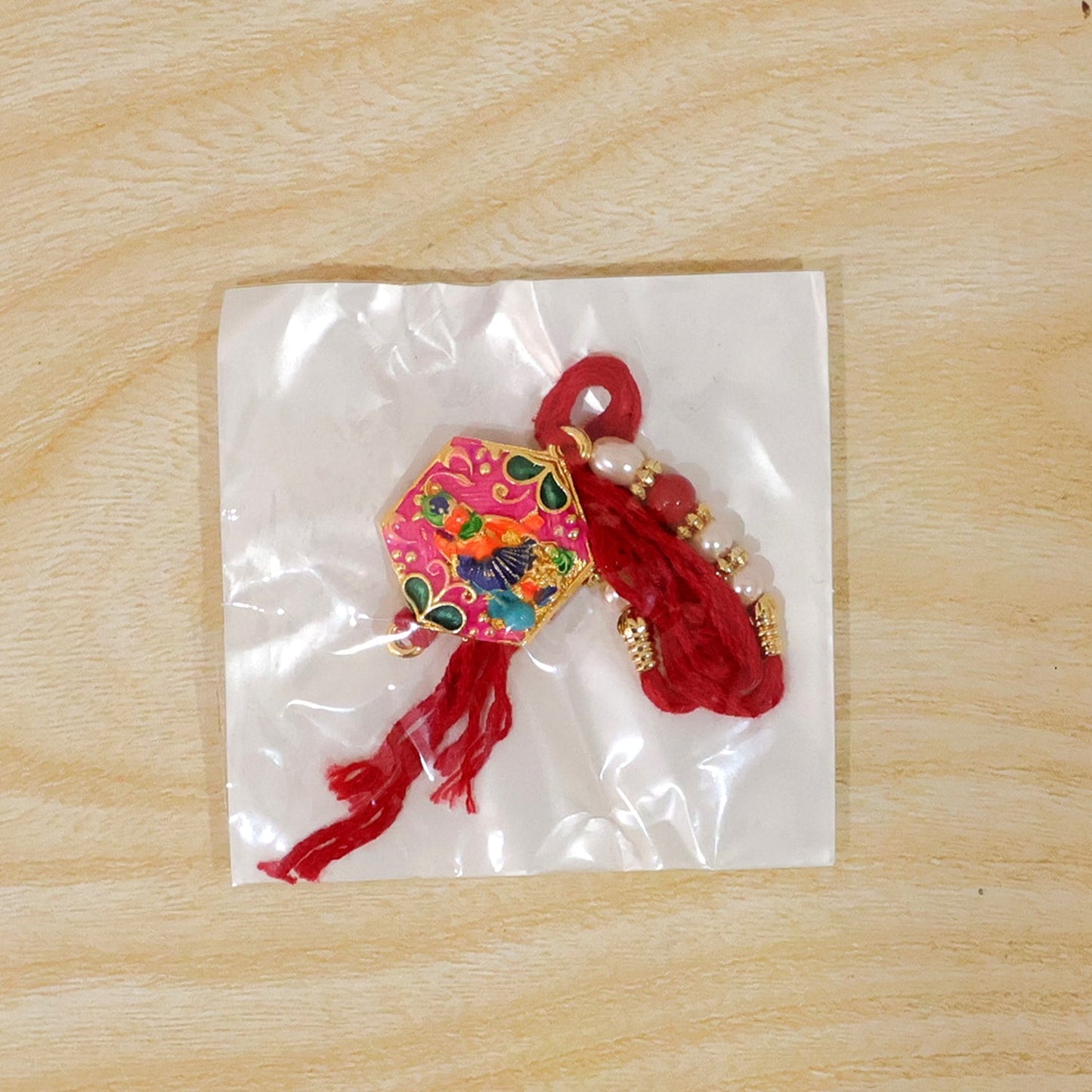 Multicolor enamel rakhi with decorative elements for Raksha Bandhan