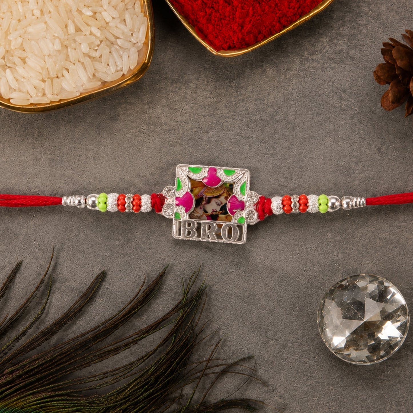 Close-up of the colorful 'Bro' text frame Rakhi showcasing enamel details