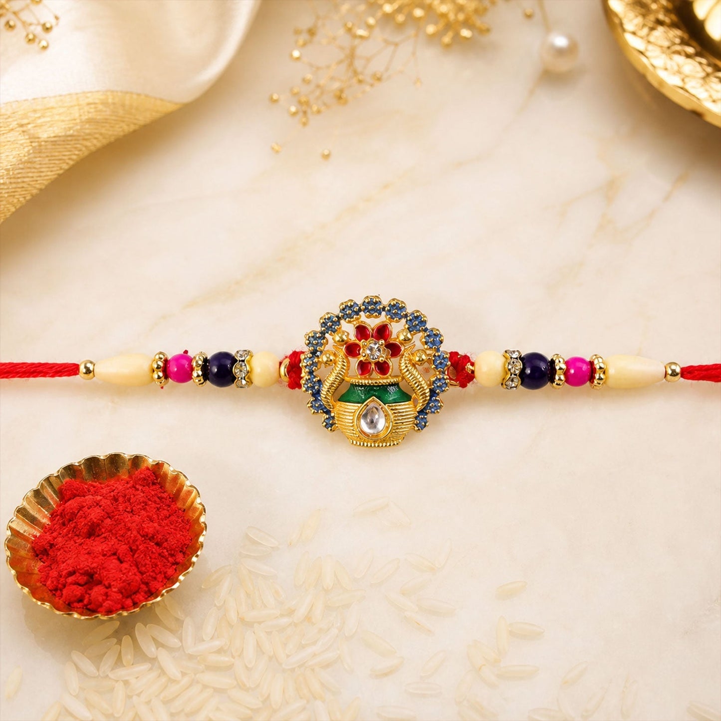 Festive angled shot of Kalash Rakhi with colorful beads