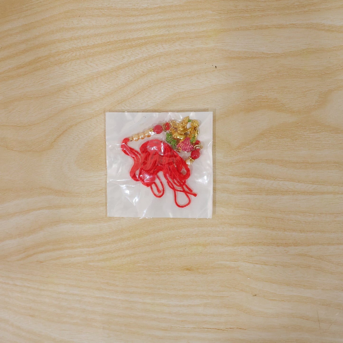 Radha Krishna rakhi displayed on festive background with vibrant colors