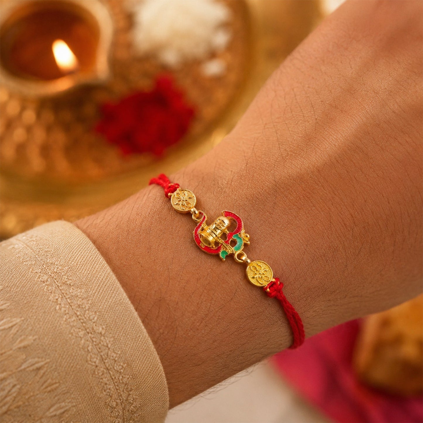 Front view of Shivling Enamel Gold Tone Rakhi with spiritual design