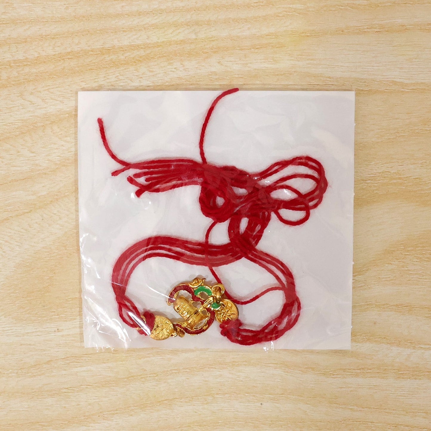 Back view of Shivling Rakhi highlighting its sturdy thread and design