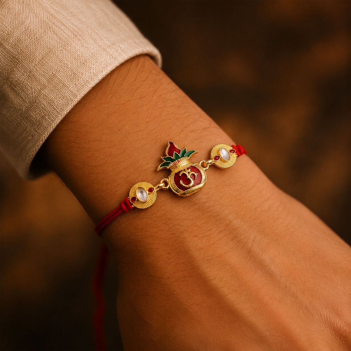 Close-up of Om Lotus Rakhi with detailed enamel work and gold accents