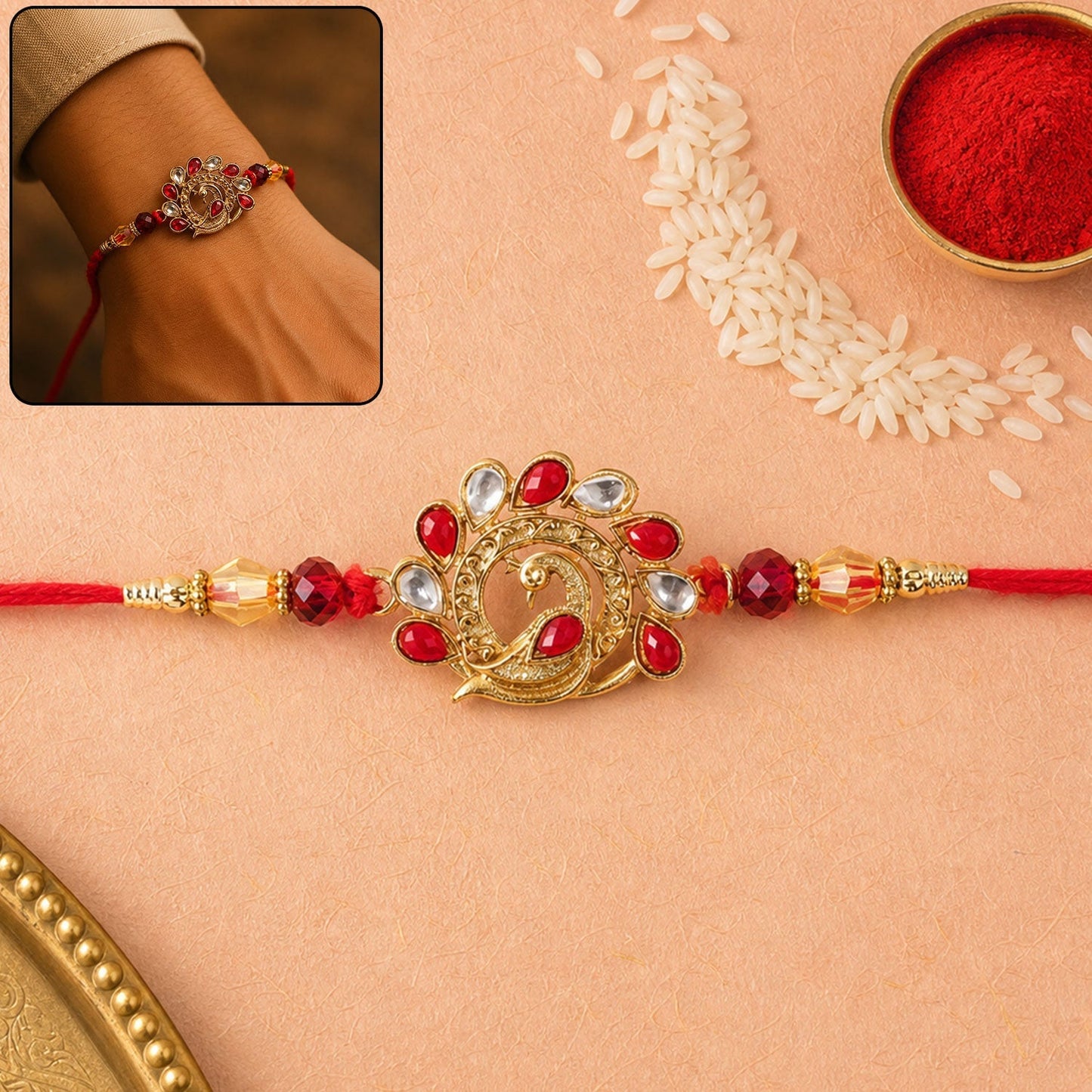 Vibrant Peacock Rakhi with red stones and traditional design, perfect for Raksha Bandhan celebrations.