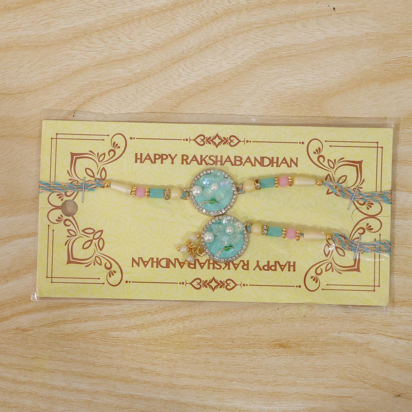 Premium teal floral pearl drops Rakhi for Raksha Bandhan celebrations