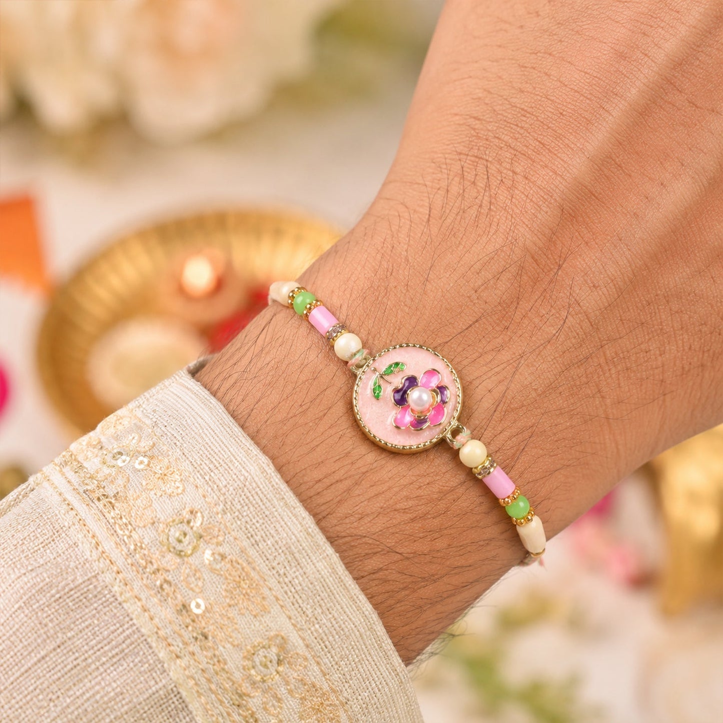 Elegant pink floral Rakhi with kundan and pearls for sister-in-law