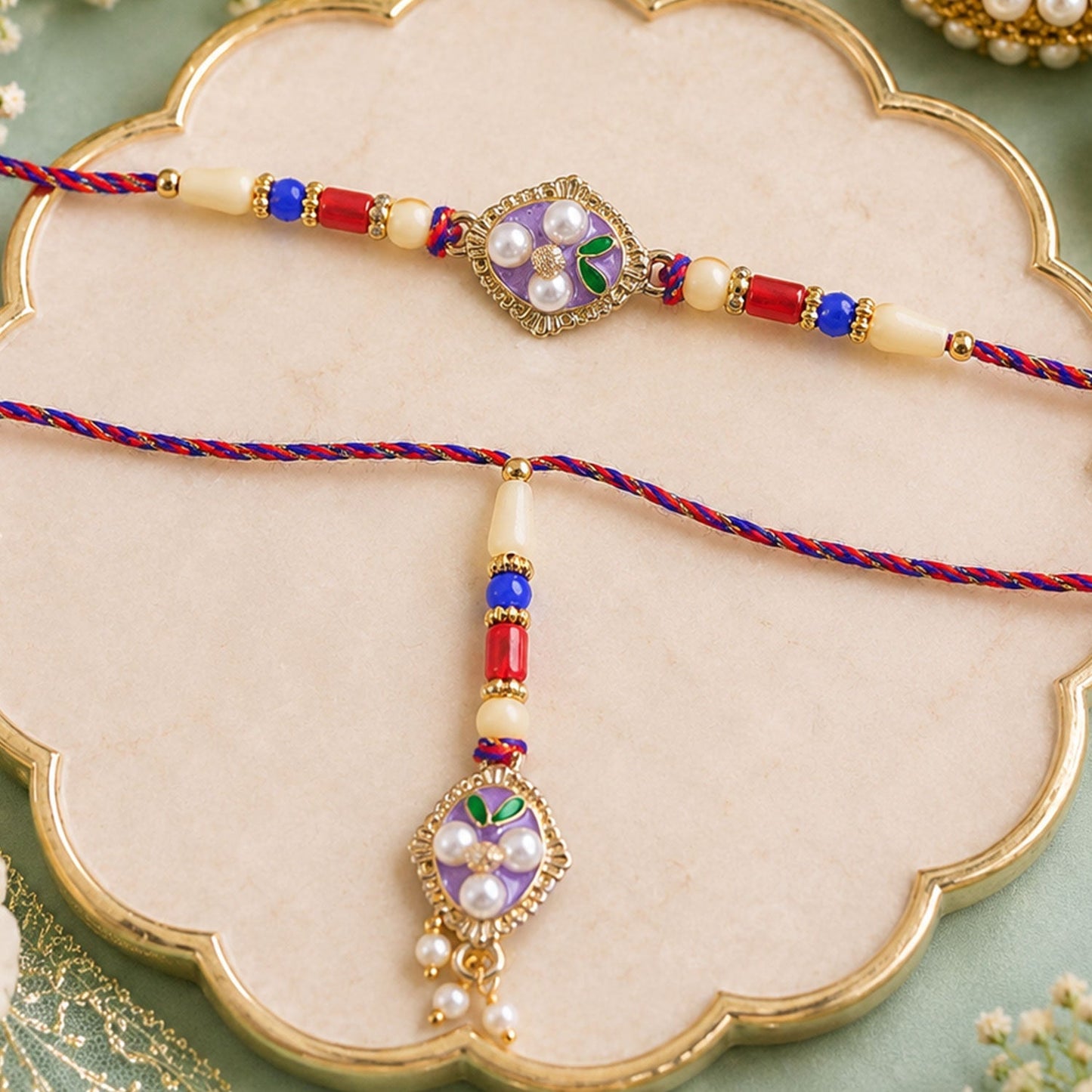 Elegant pearl and stone detailed rakhi with traditional look