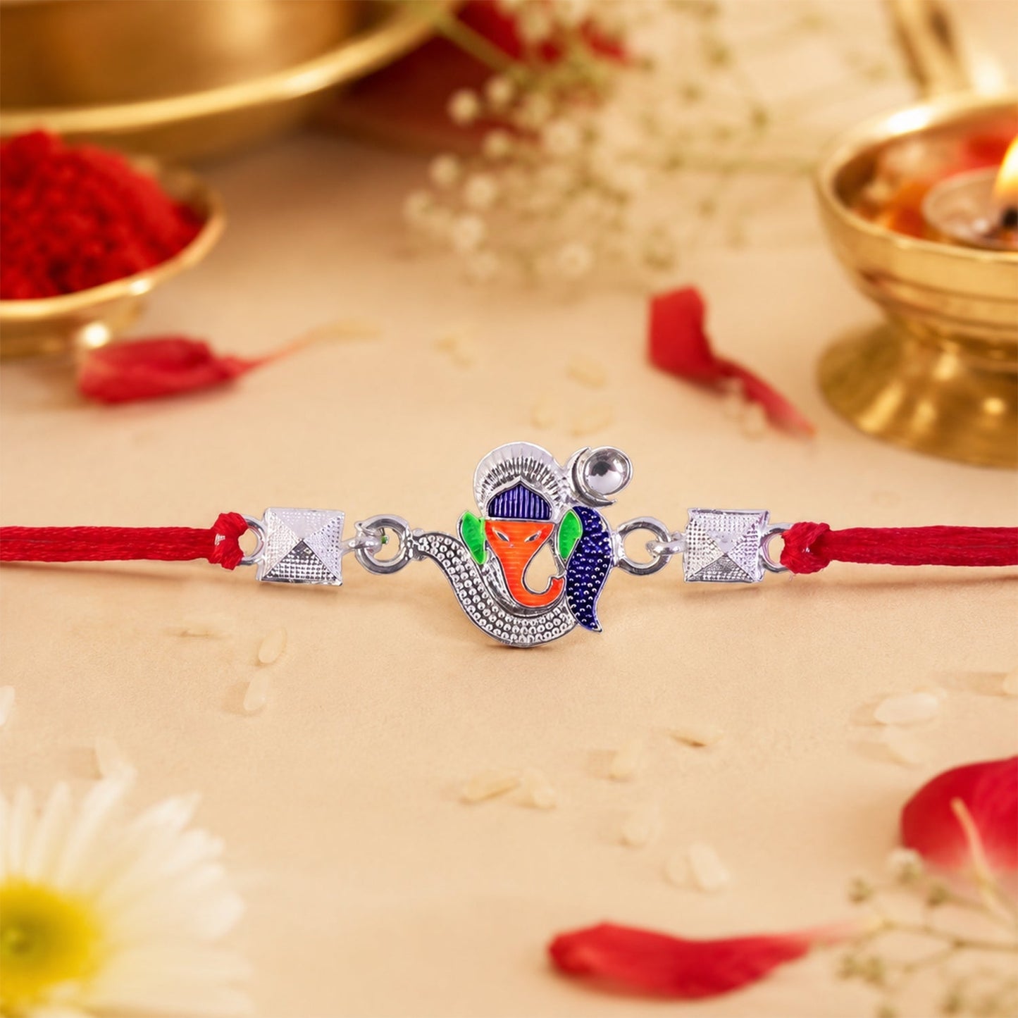 Close-up of Silver Ganesha enamel charm Rakhi for Raksha Bandhan