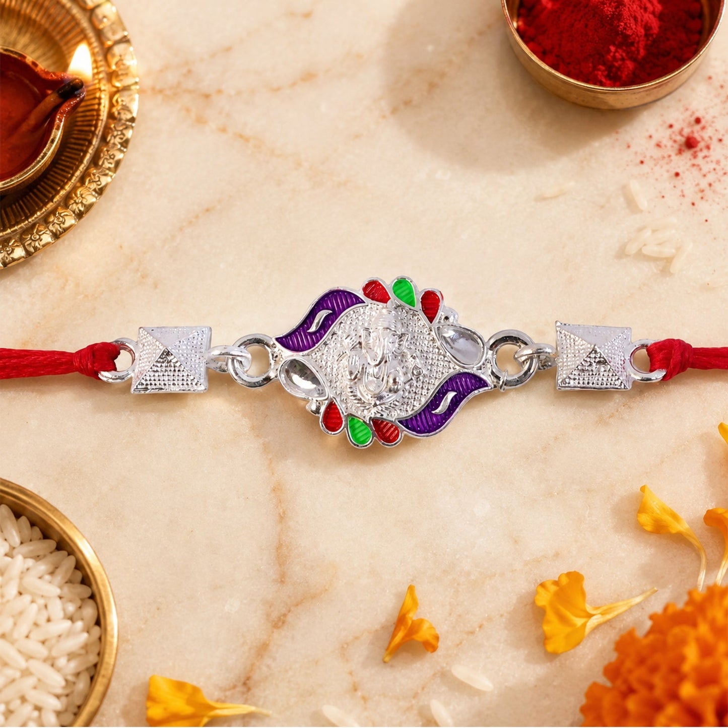 Traditional Ganesha motif on vibrant rakhi for Raksha Bandhan