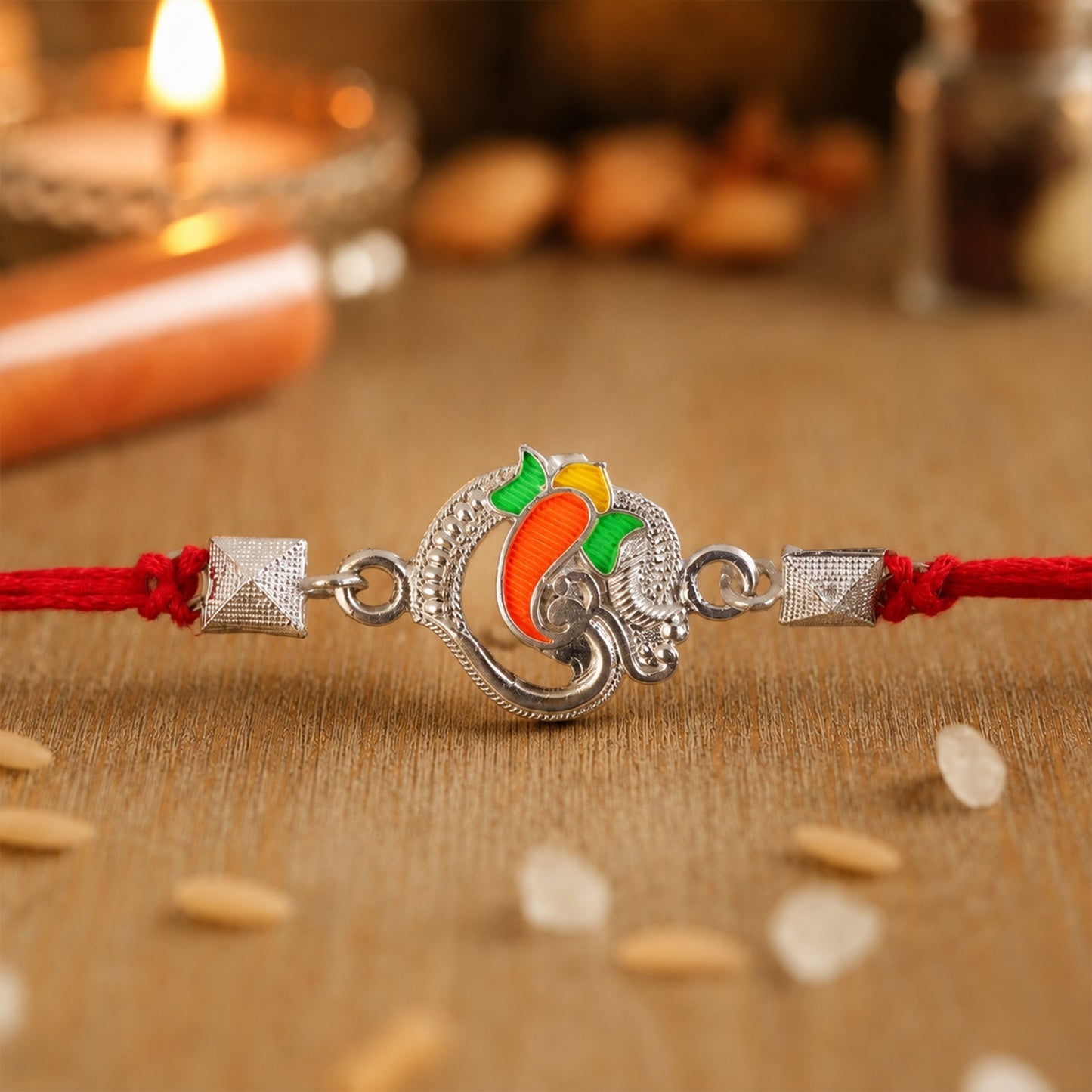 Silver Om Ganesha enamel bead Rakhi with colorful thread for Raksha Bandhan