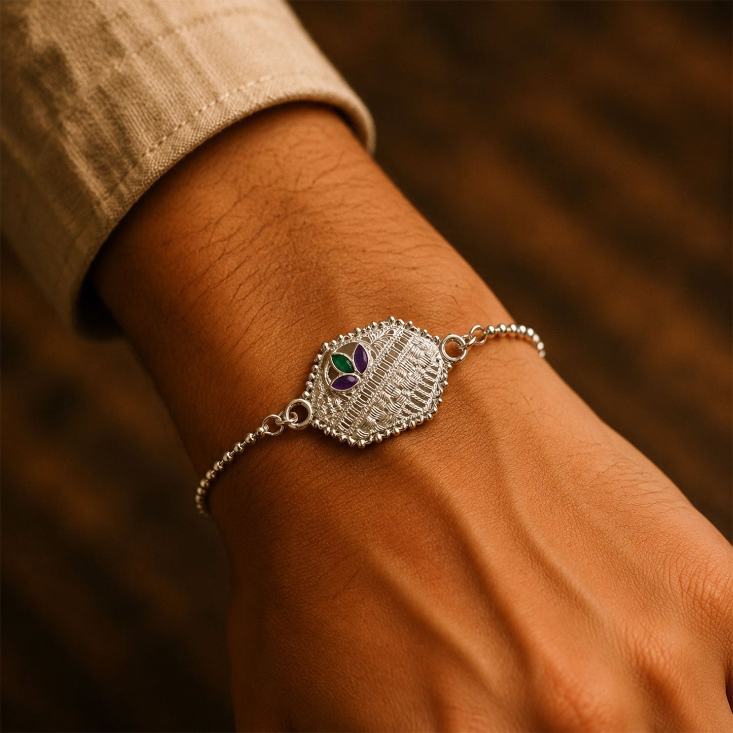 Close-up of silver enamel bracelet with intricate design, perfect for Rakhi