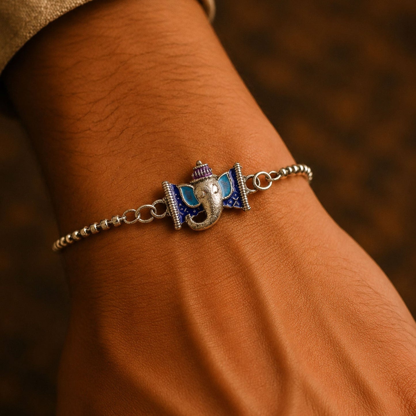 Close-up of Silver Ganesha enamel bracelet showcasing vibrant design