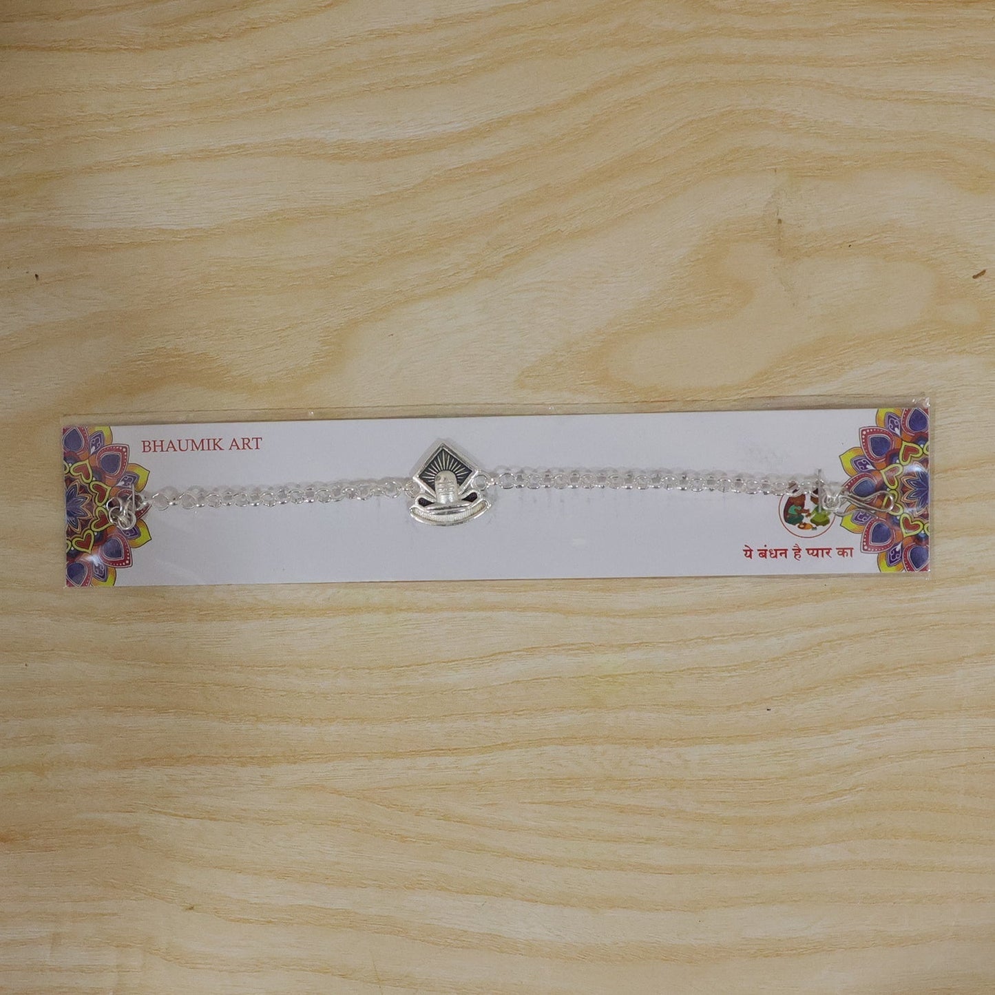 Festive Shiv Lingam Rakhi with vibrant enamel colors and premium finish