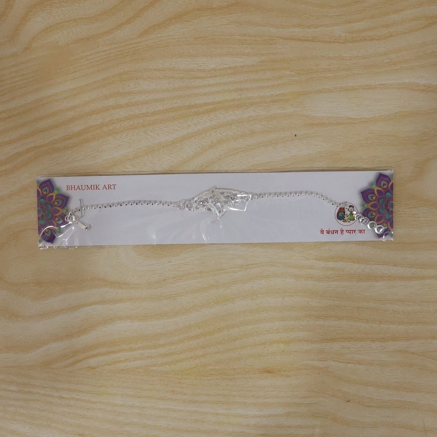 Festive Rakhi with diamond leaf motif, perfect for Raksha Bandhan celebration