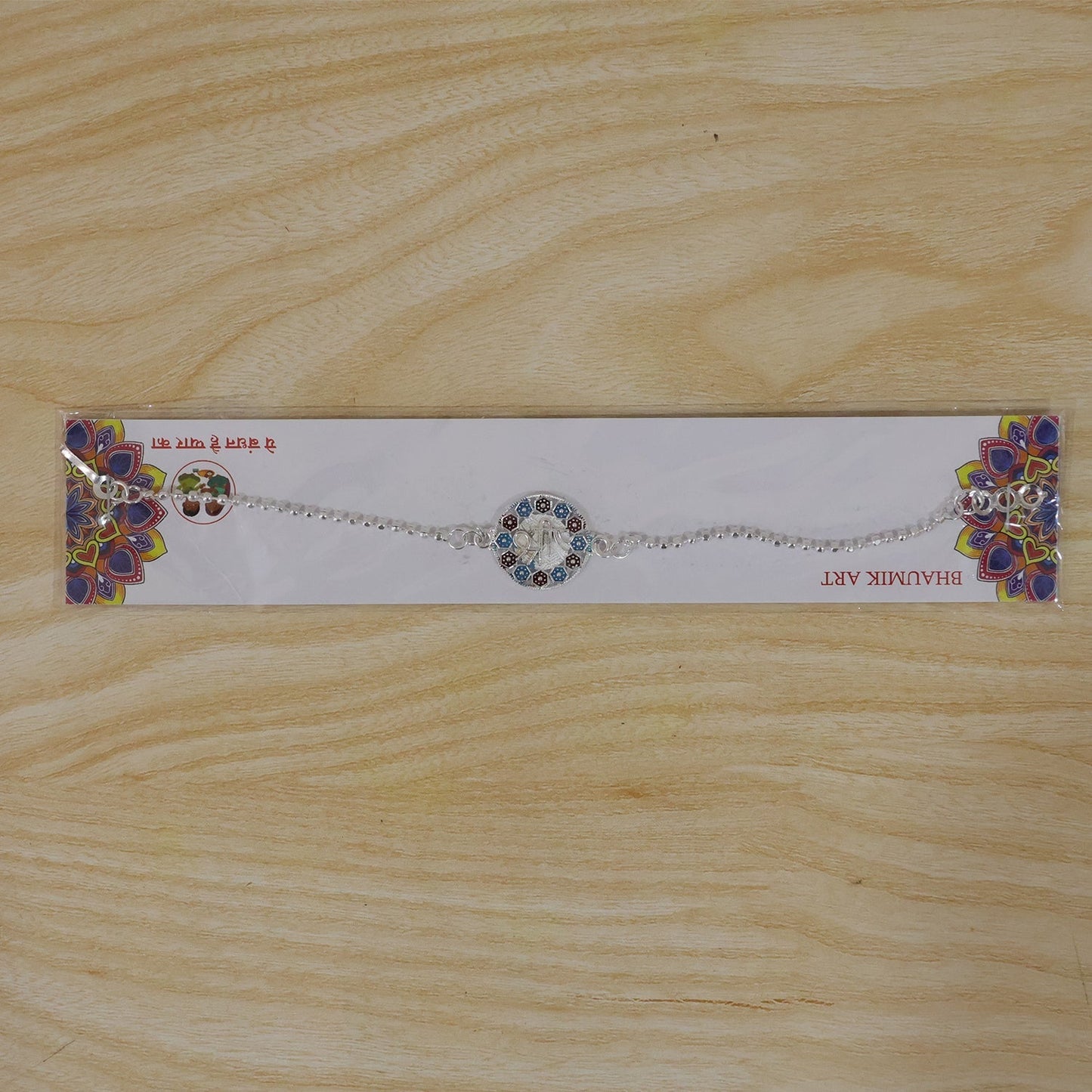 Vibrant enamel Rakhi with attractive design and premium finish for brothers