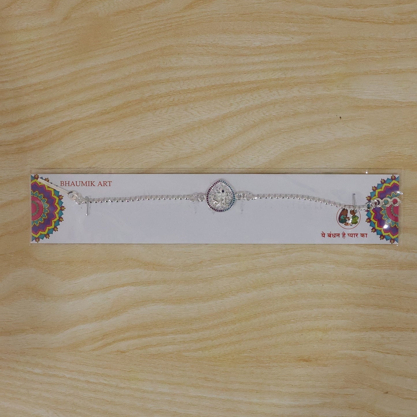 Stylish and durable Shree symbol enamel rakhi for Raksha Bandhan