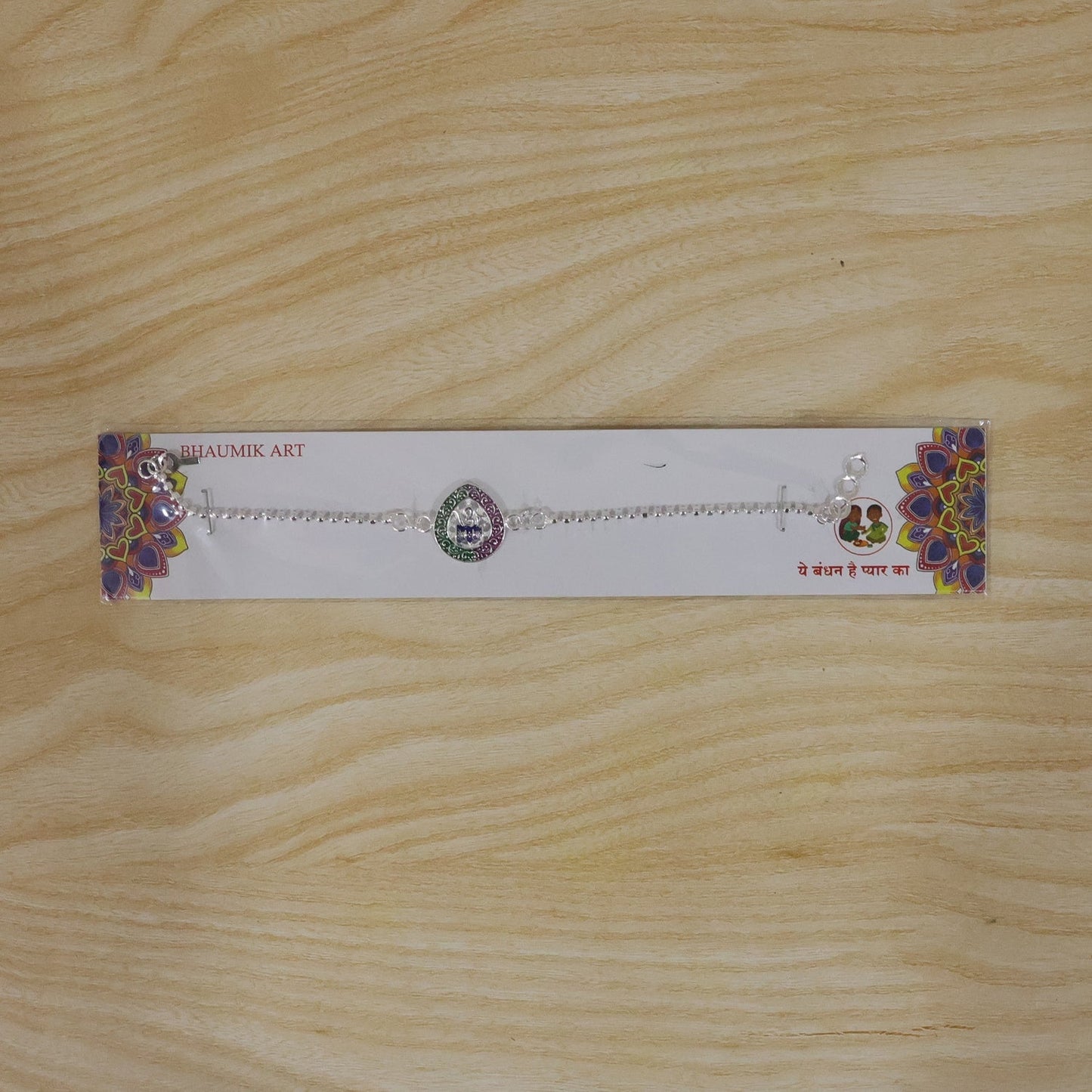Premium design of spiritual Om Damaru rakhi for brothers