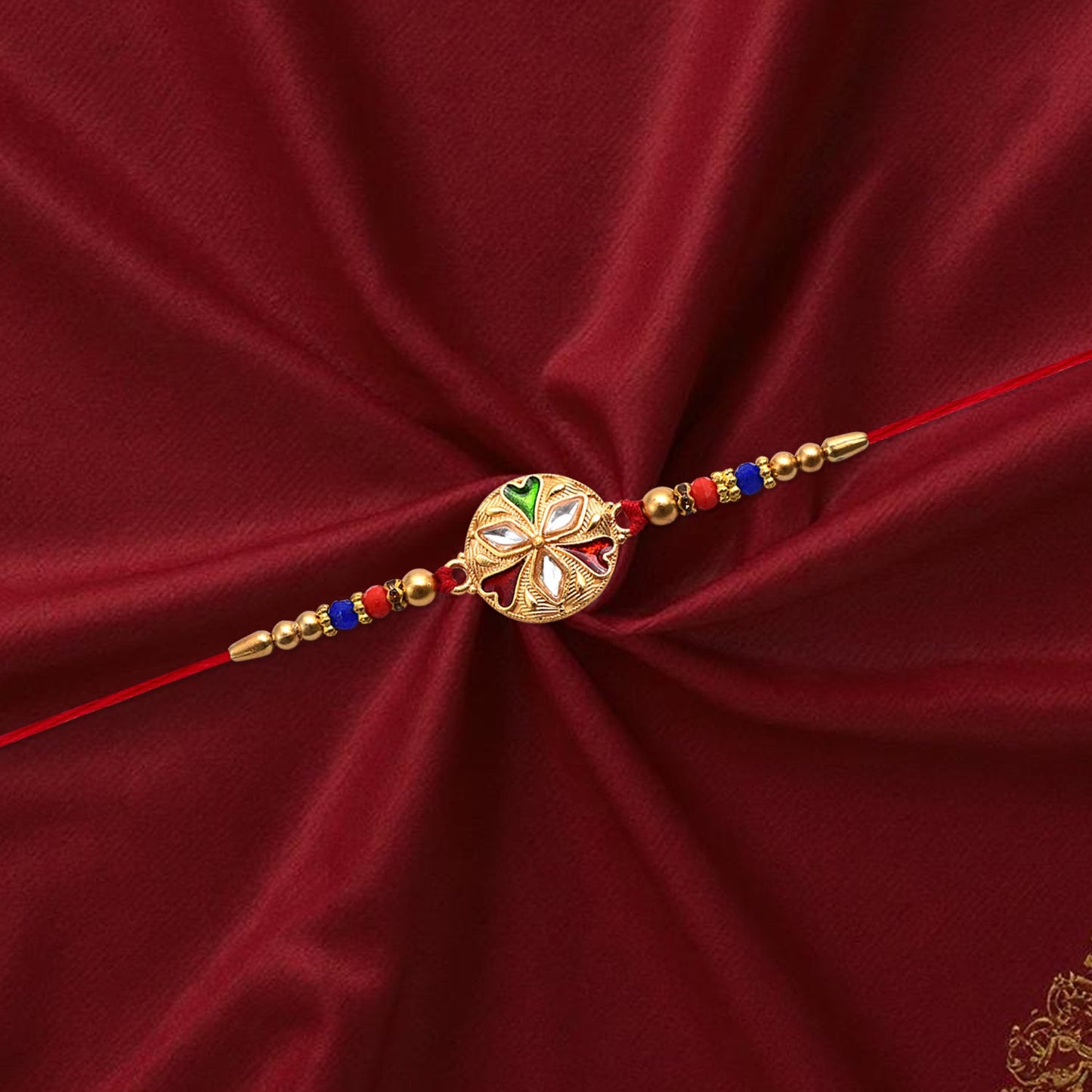 Floral rakhi with mirror work and colorful beads on red thread