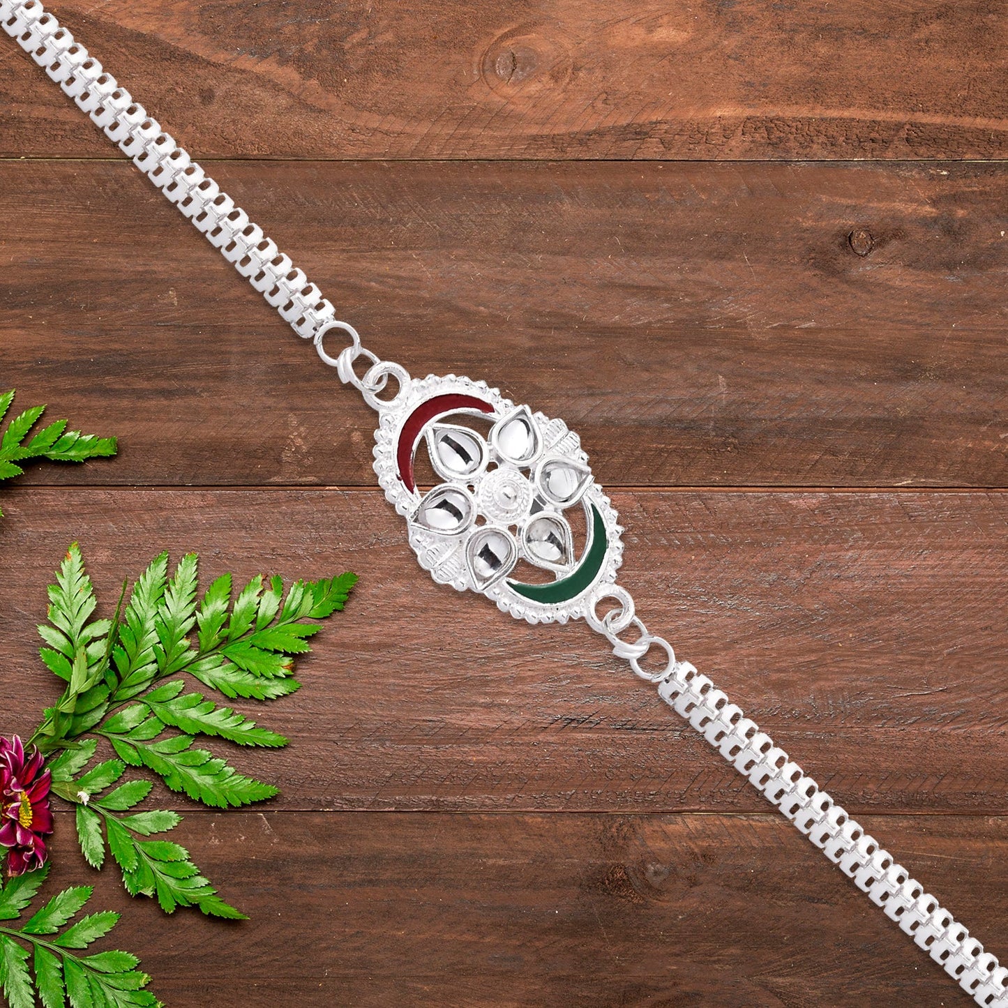 Beautiful Silver Rakhi placed on festive background ready for Raksha Bandhan celebrations.