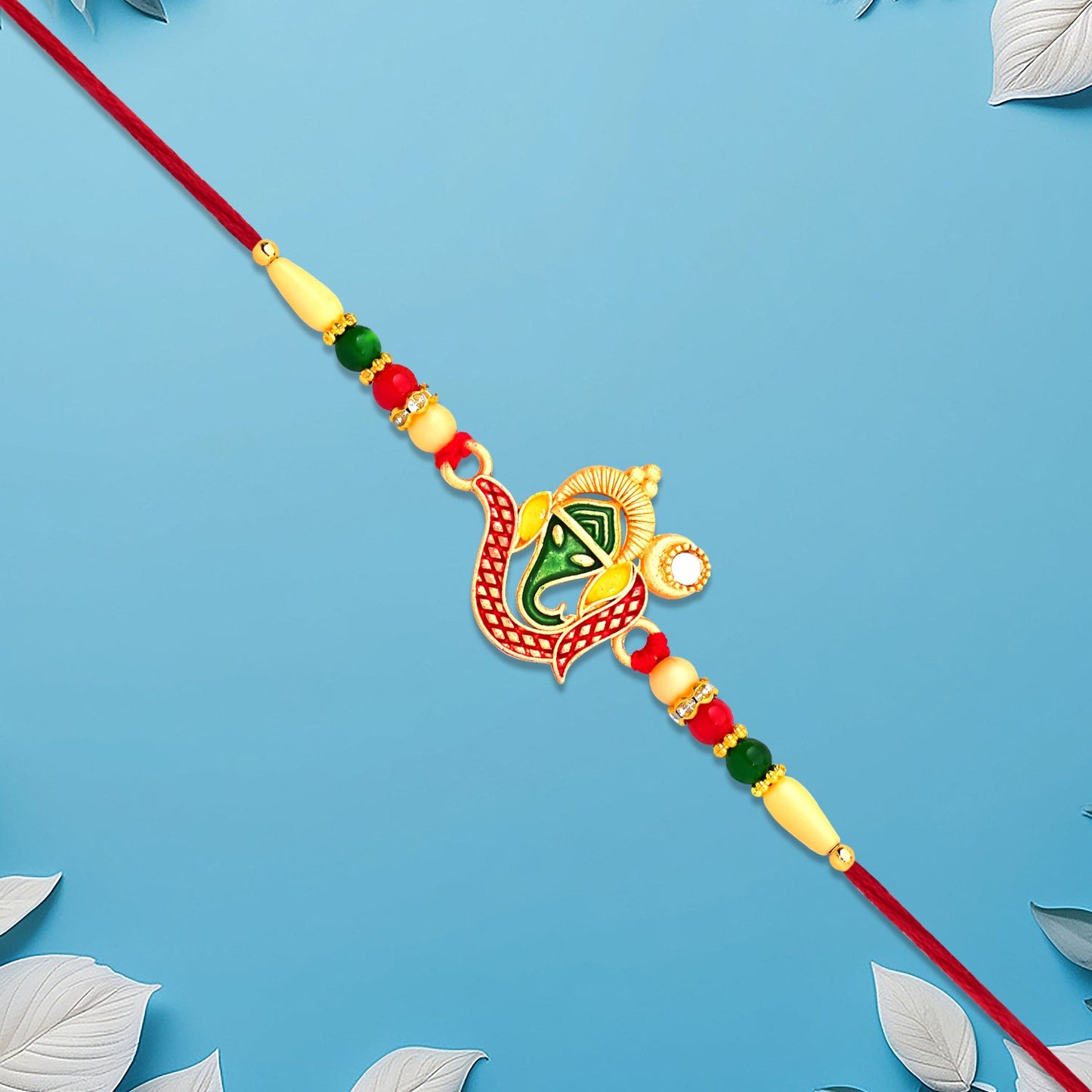 Elegant Ganpati Rakhi styled with traditional Indian festive decor for Raksha Bandhan
