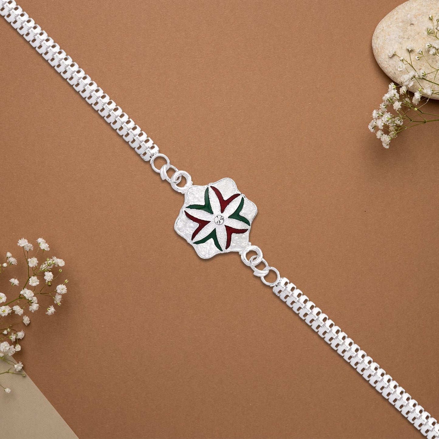 Handcrafted Silver Chain Rakhi showcasing flower design and artistry