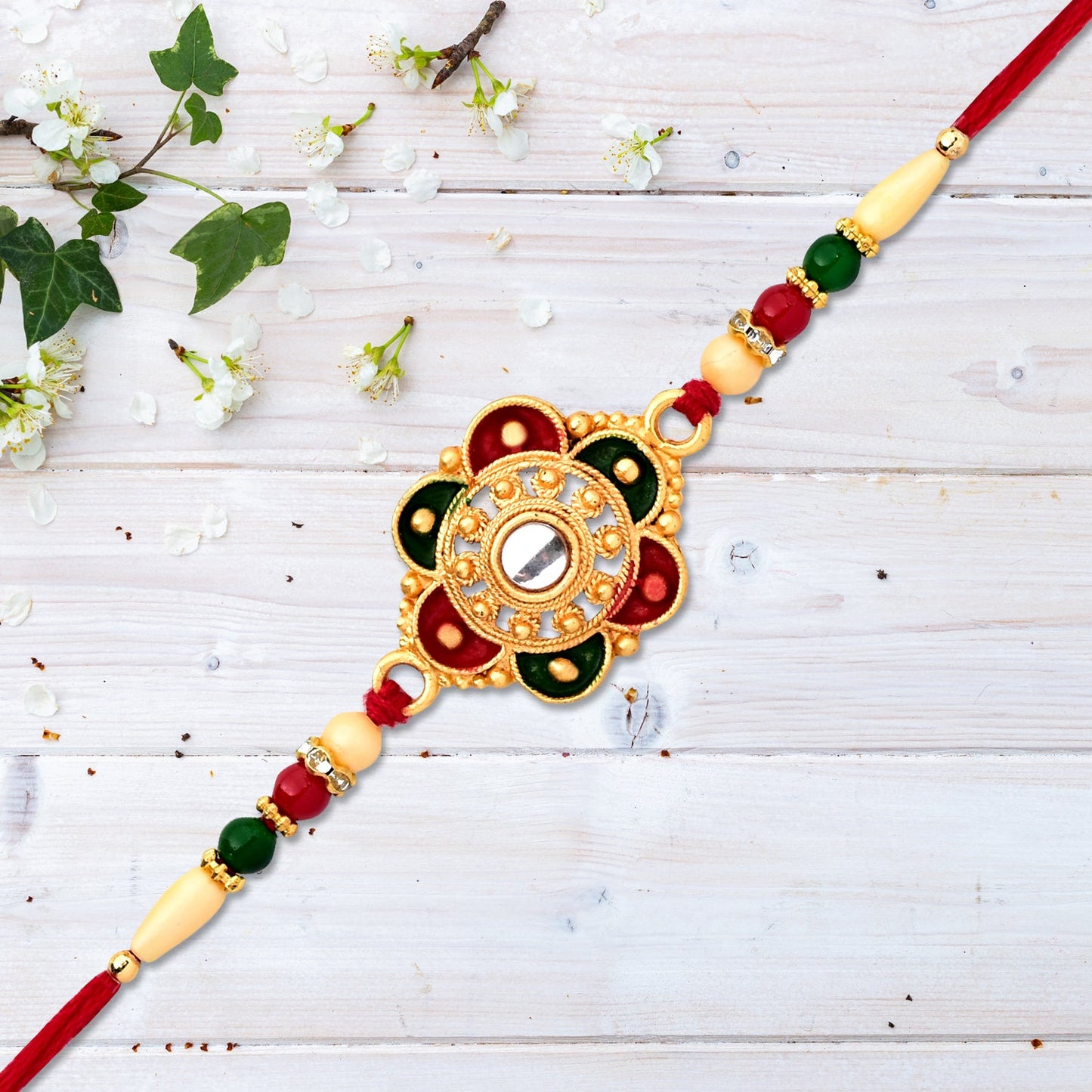 Traditional Rakhi featuring floral design with beads on festive thread