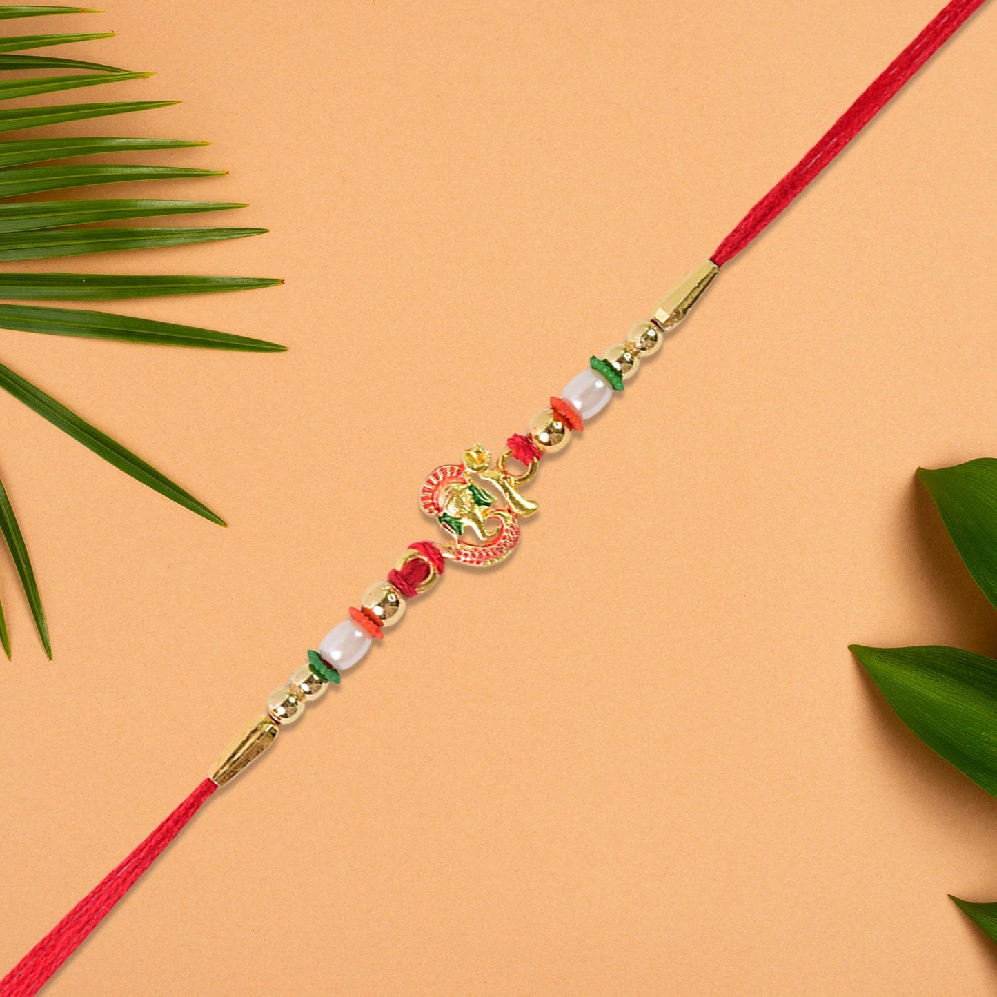 Close-up of a meticulously crafted Gold-Toned Rakhi showcasing intricate traditional patterns and embellishments.