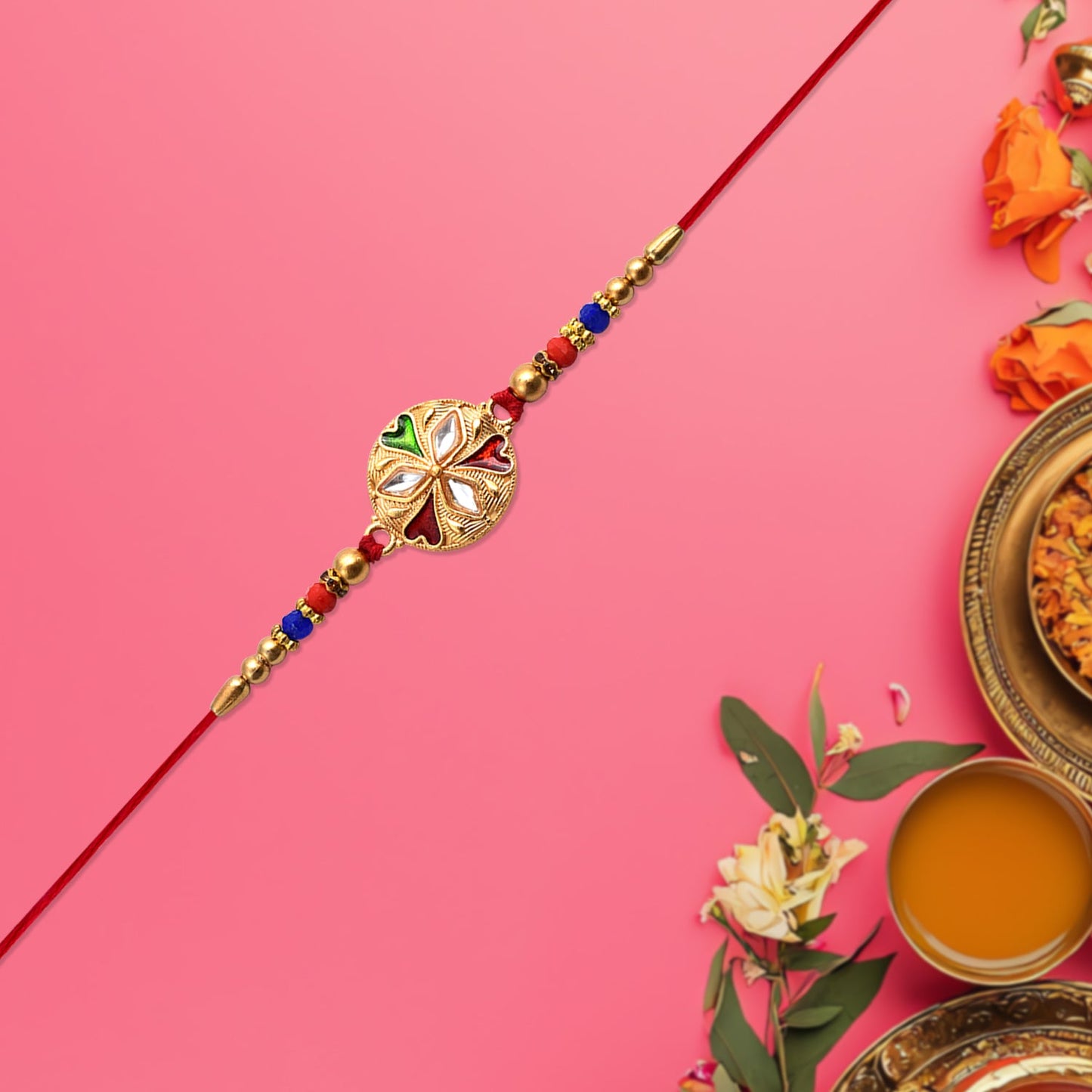 Close-up of floral rakhi showing mirror detailing and colorful beads