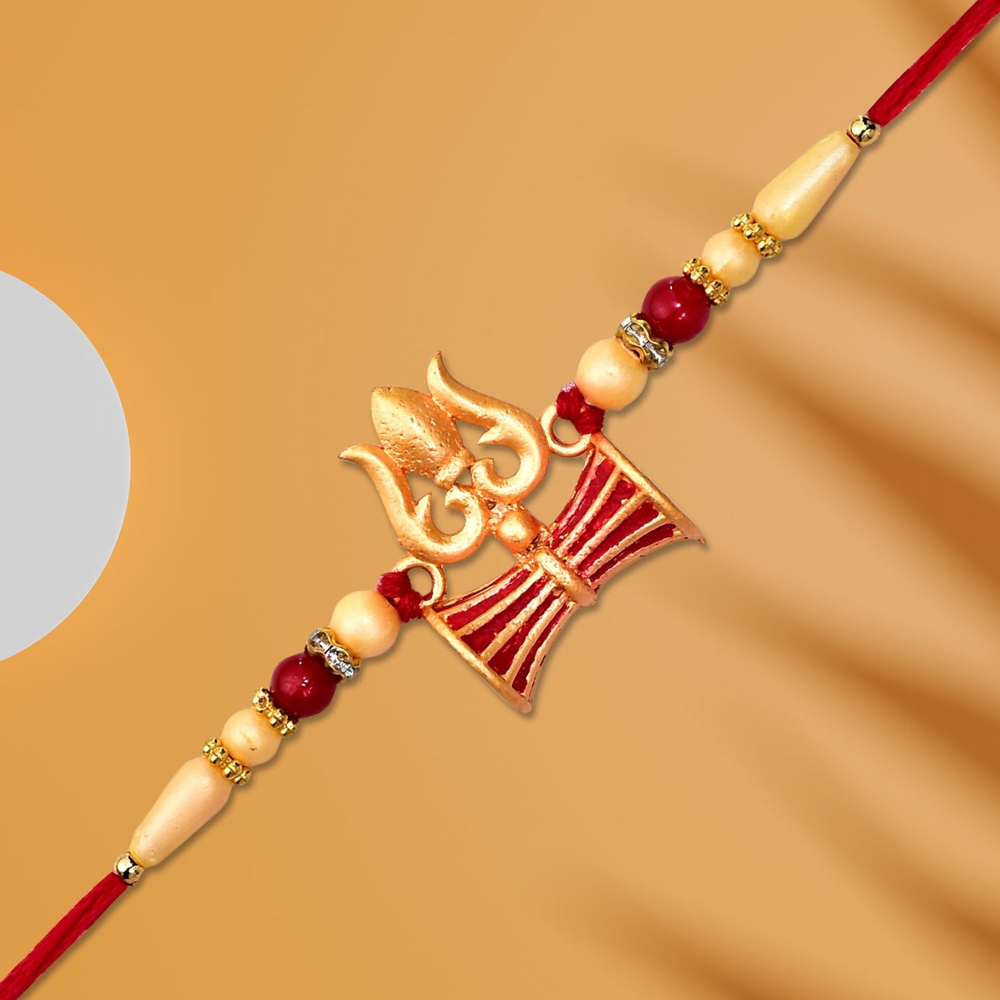 Top-down shot of Shiva Trishul Rakhi symbolizing sibling love for Rakshabandhan.