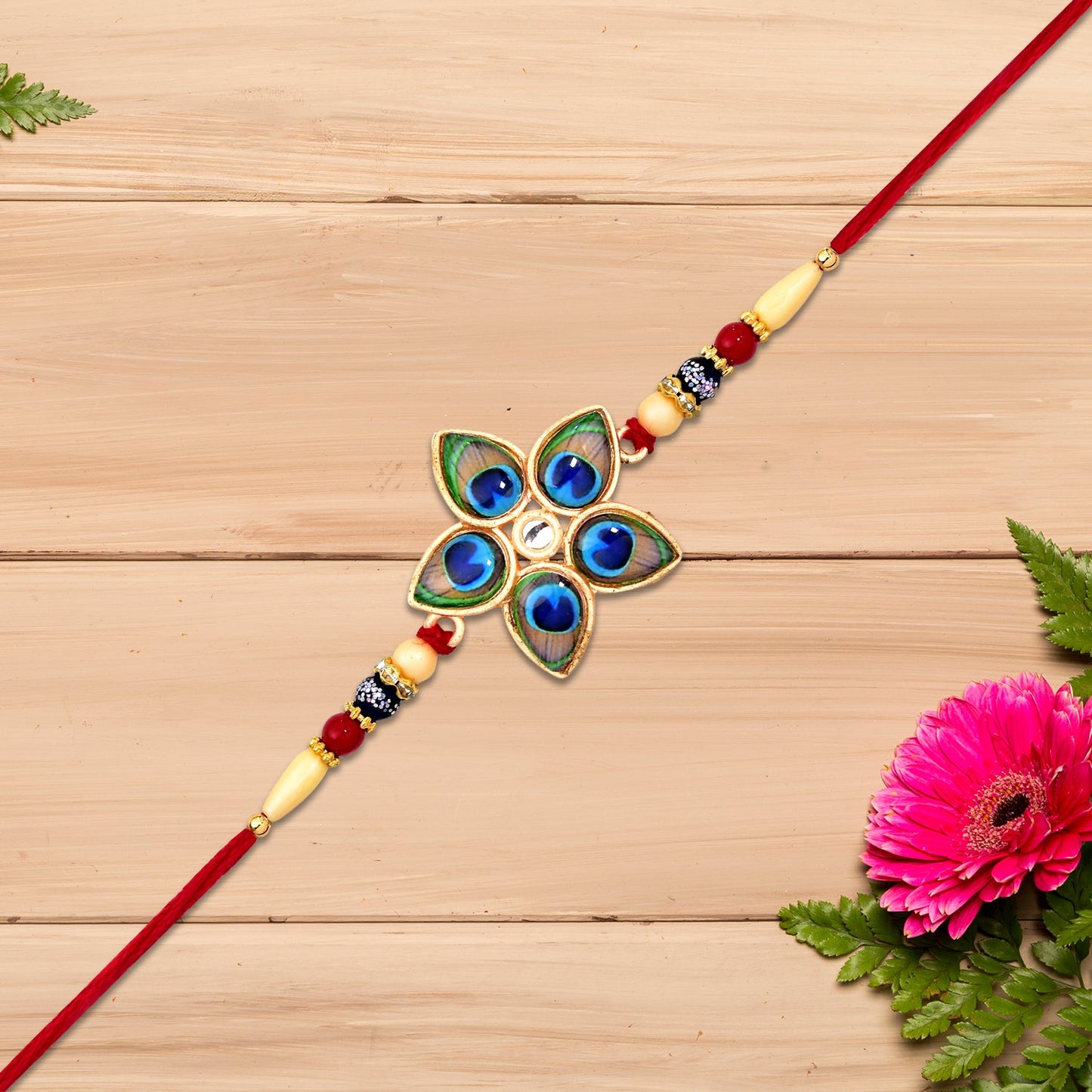 Elegant Mor Pankh Rakhi with vibrant colors and star design