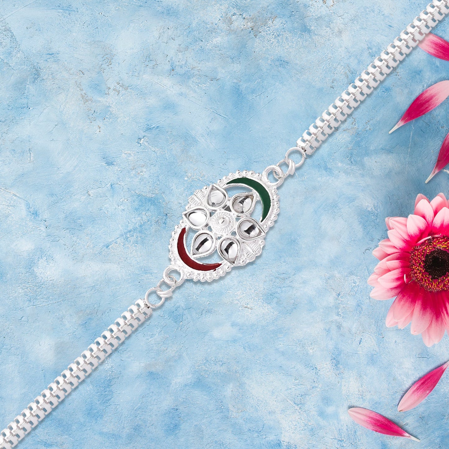 Handcrafted Silver Rakhi showing vibrant tricolor highlights combined with intricate chain style.