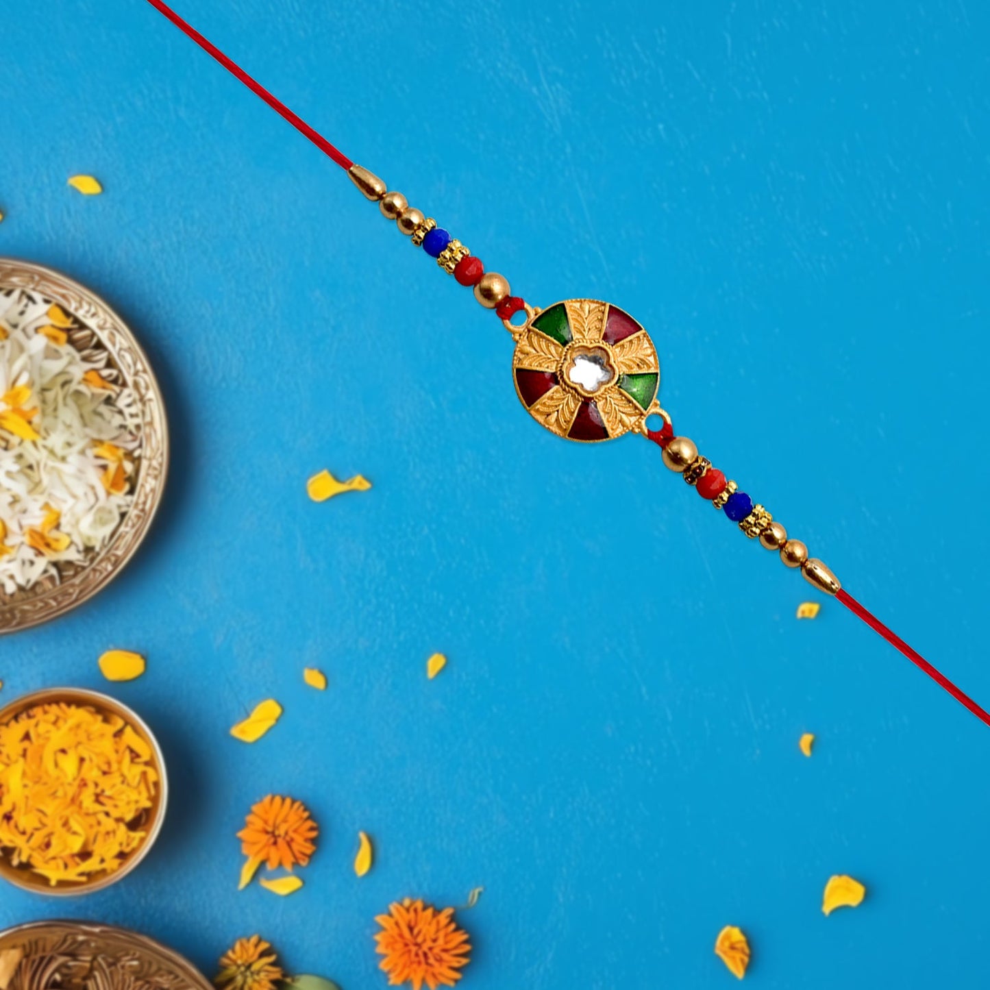 Beaded red thread attached to multicolor kundan rakhi