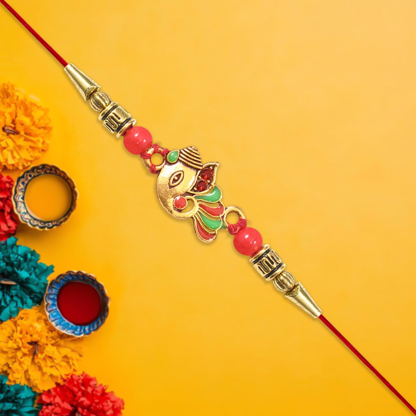 Intricately designed Ganpati Rakhi featuring vibrant colors and festive motifs.