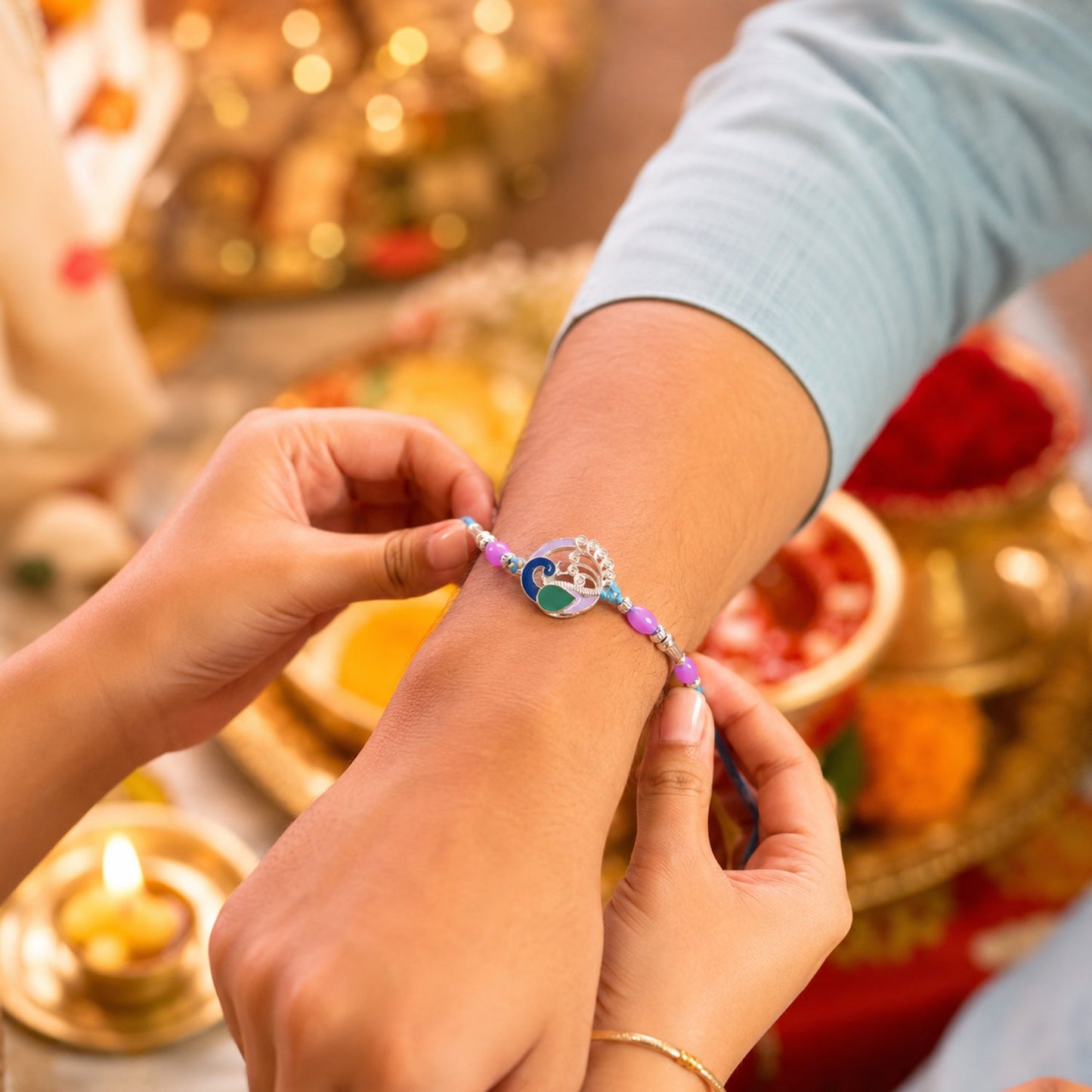 Close-up of Peacock-designed Rakhi with decorative beads and stylish centerpiece