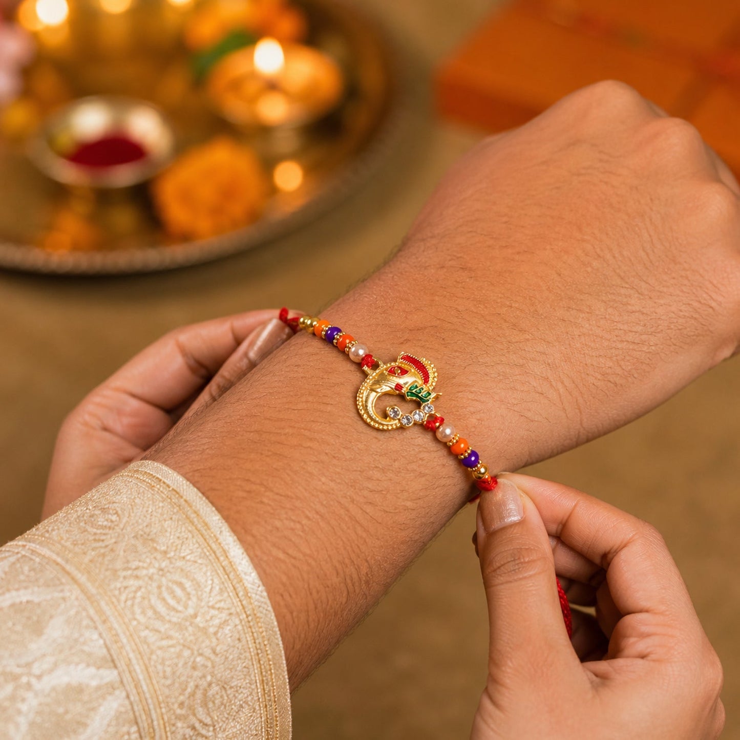 Side view of Ganesh Rakhi showing soft thread and beads
