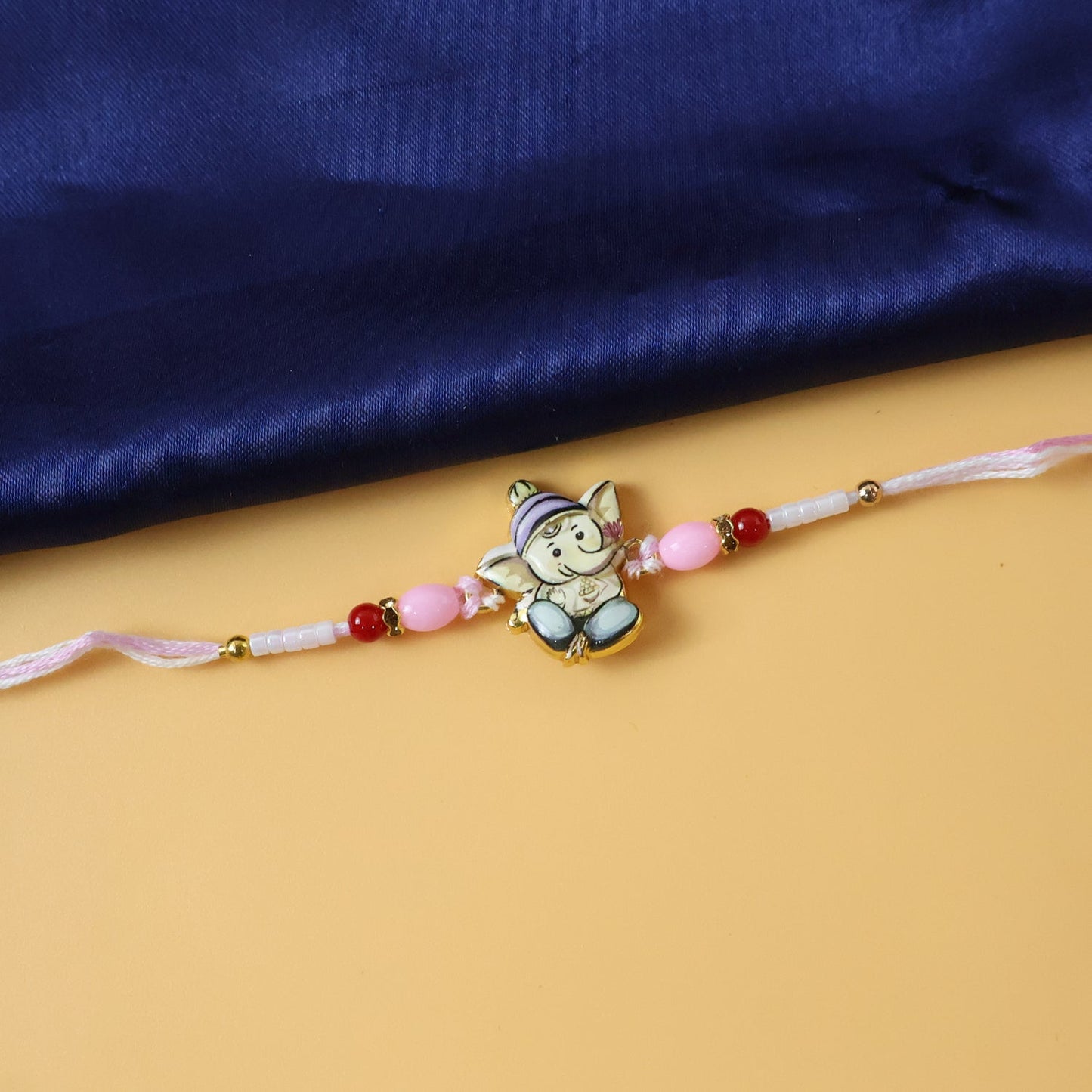 Soft thread of Ganesha Rakhi showing comfort and quality