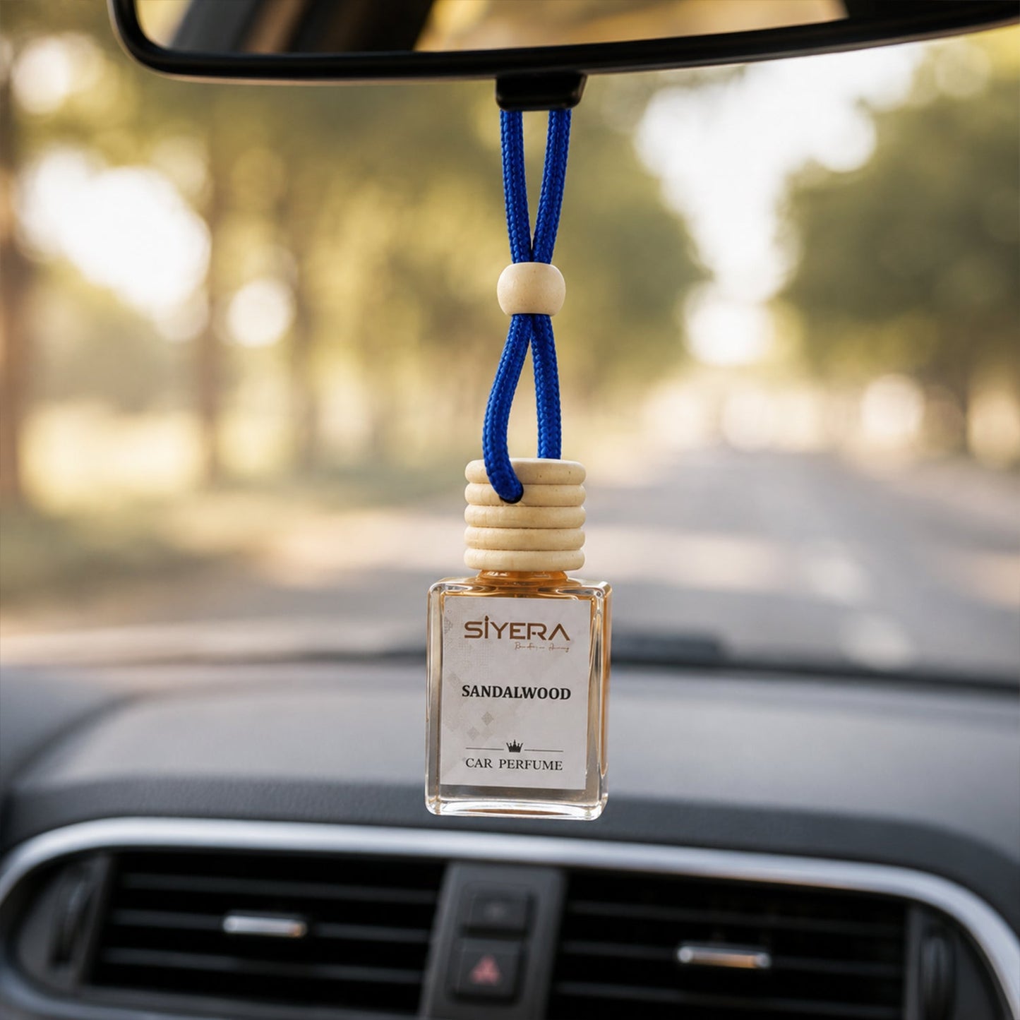 Siyera Sandalwood Car Perfume bottle with wooden cap on a clean white background.