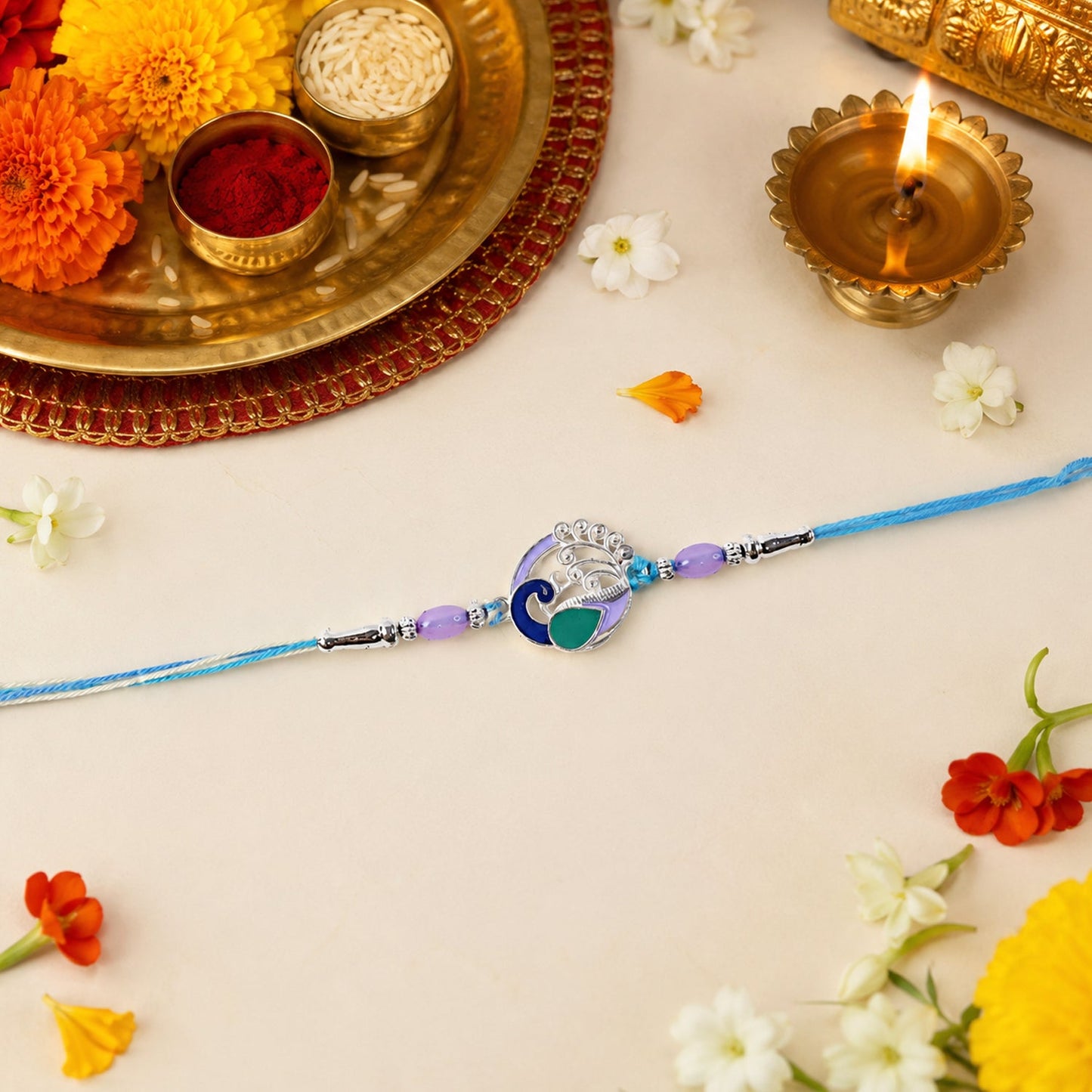 Hand holding elegant Peacock Motif Rakhi, showcasing its detailed design