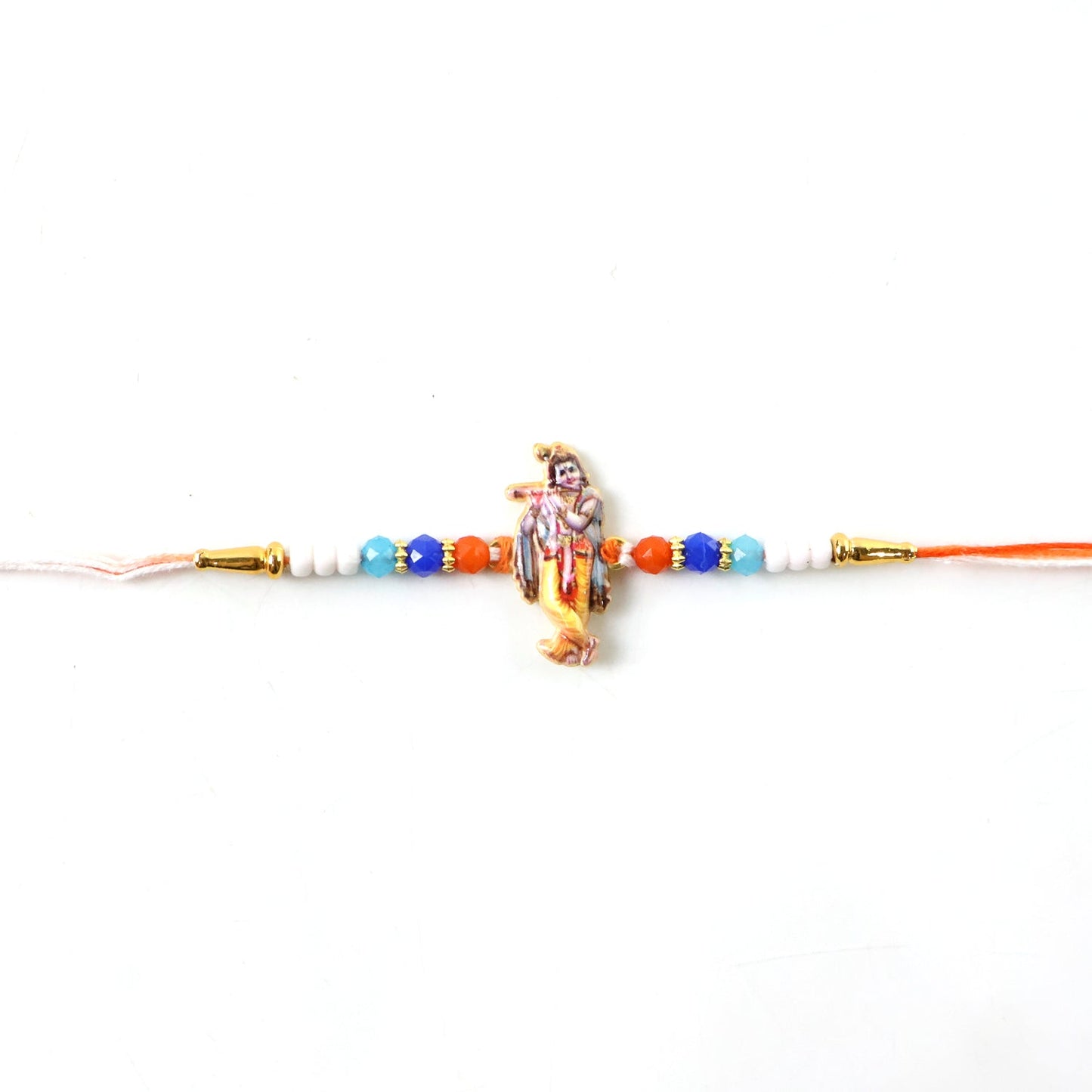 Lord Krishna Rakhi laid flat showing thread and centerpiece