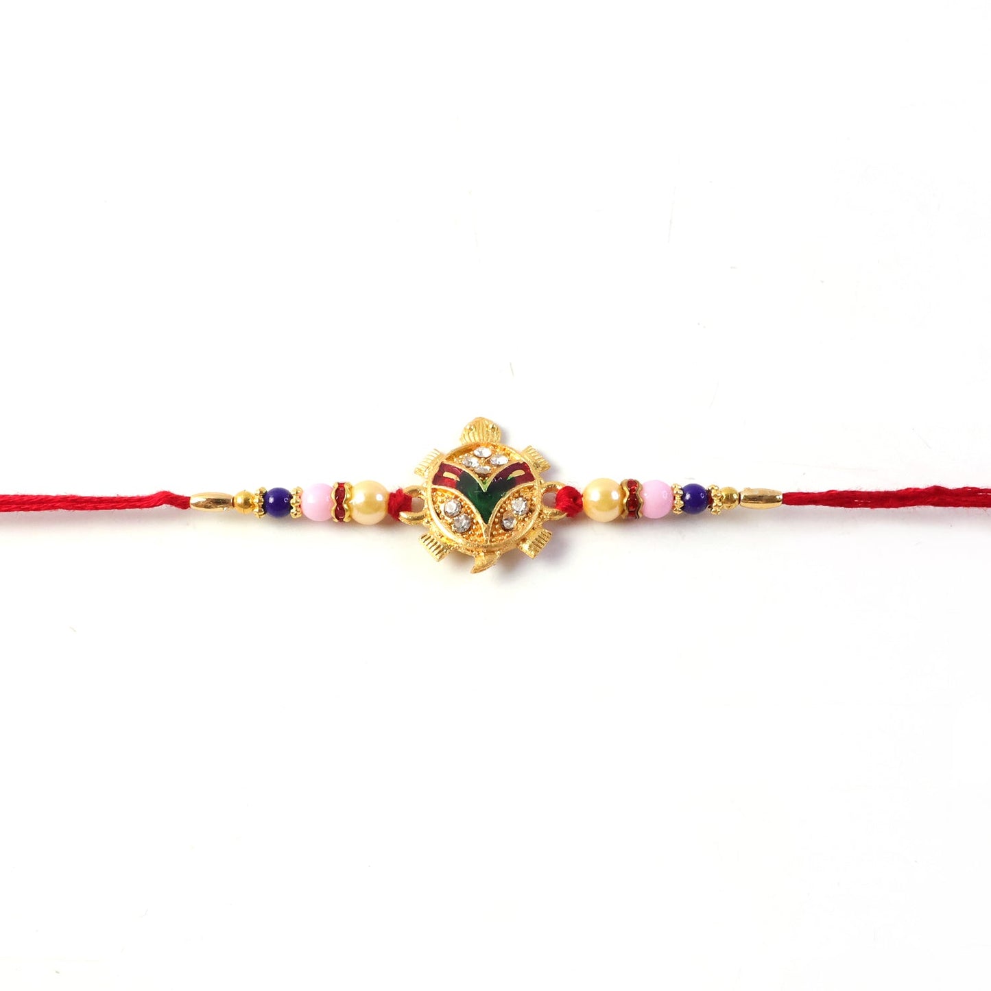 Side view of intricate Tortoise Charm on Rakhi