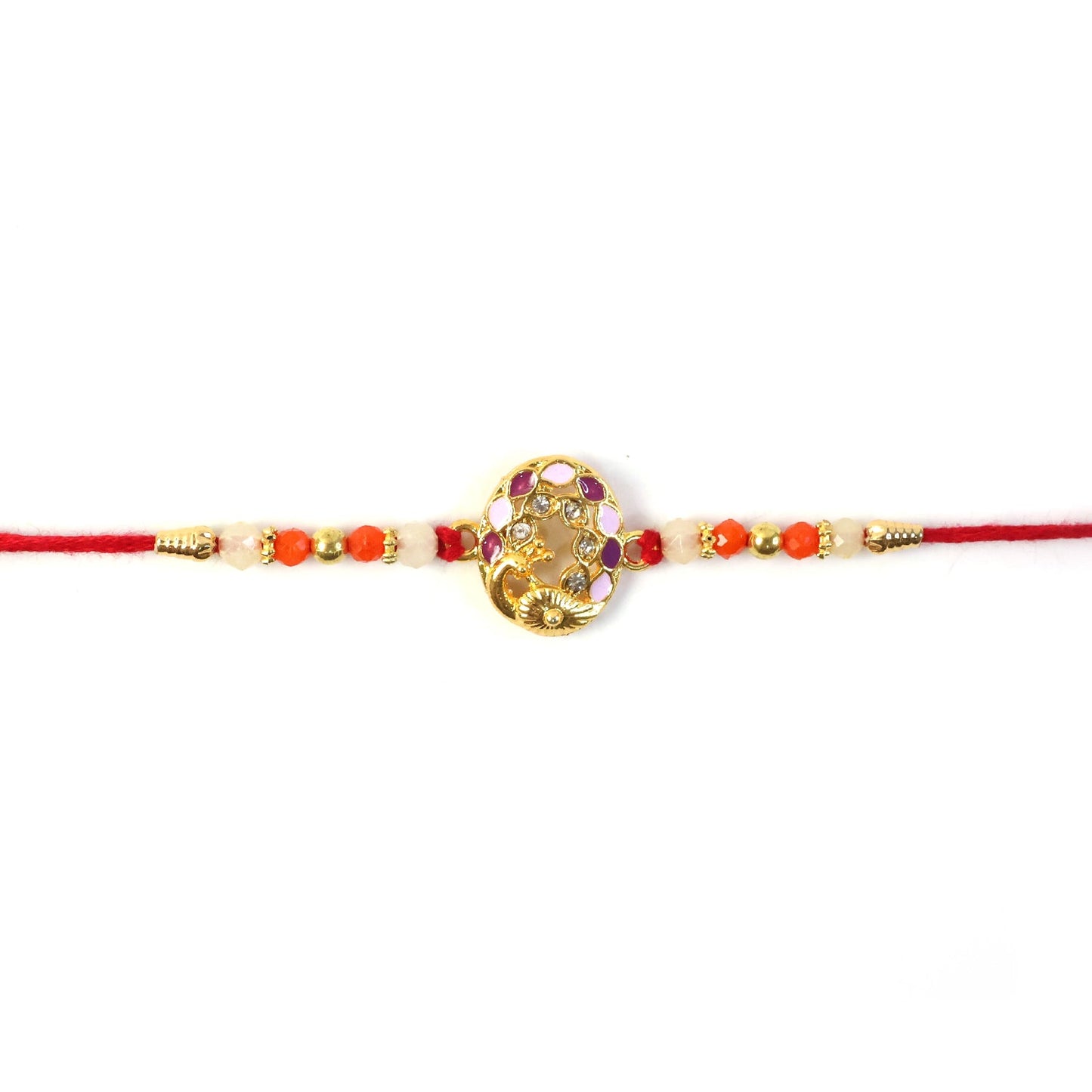 Hand holding vibrant Peacock Rakhi with bright beads and detailed design