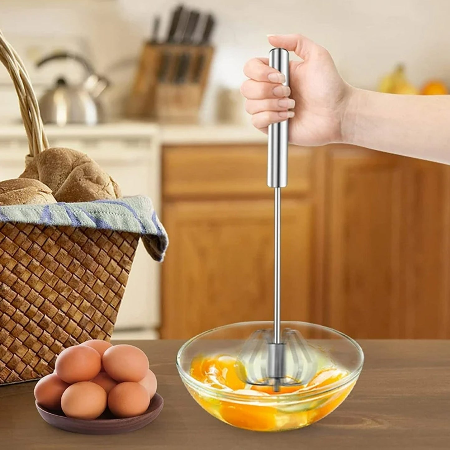 The versatile kitchen tool, a stainless steel egg whisk, on a countertop.