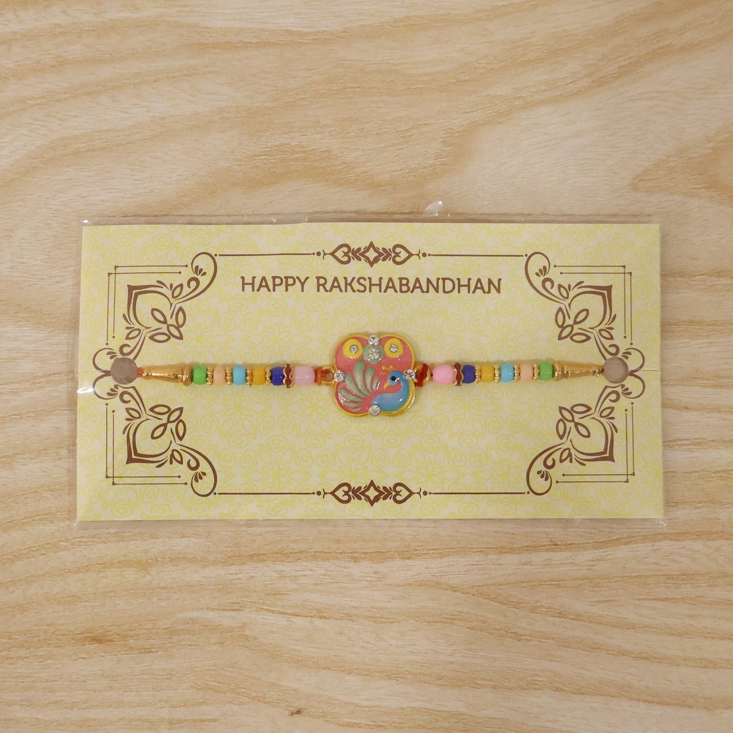 Elegant peacock motif on designer Rakhi for Raksha Bandhan