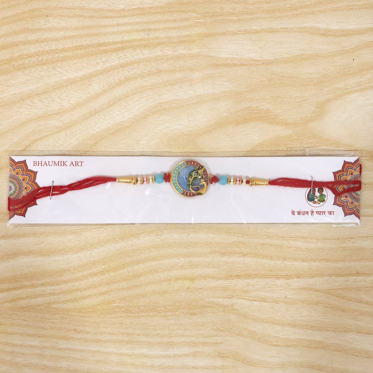 Beautifully crafted Peacock motif Rakhi for sibling celebration