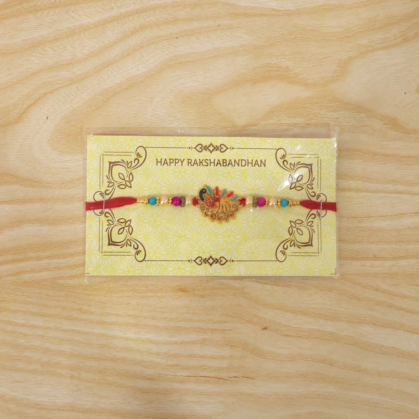 Colorful peacock Rakhi with stones and beads on soft thread