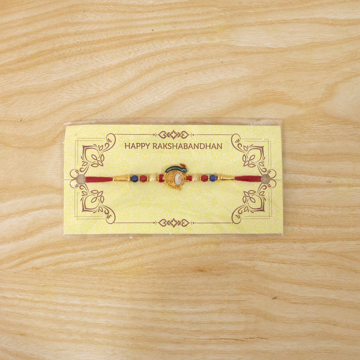 Festive Rakhi showing intricate design details with stones and beads