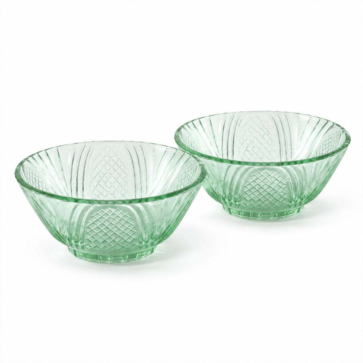 Two empty green glass bowls with a textured pattern, displayed side by side on a white background.