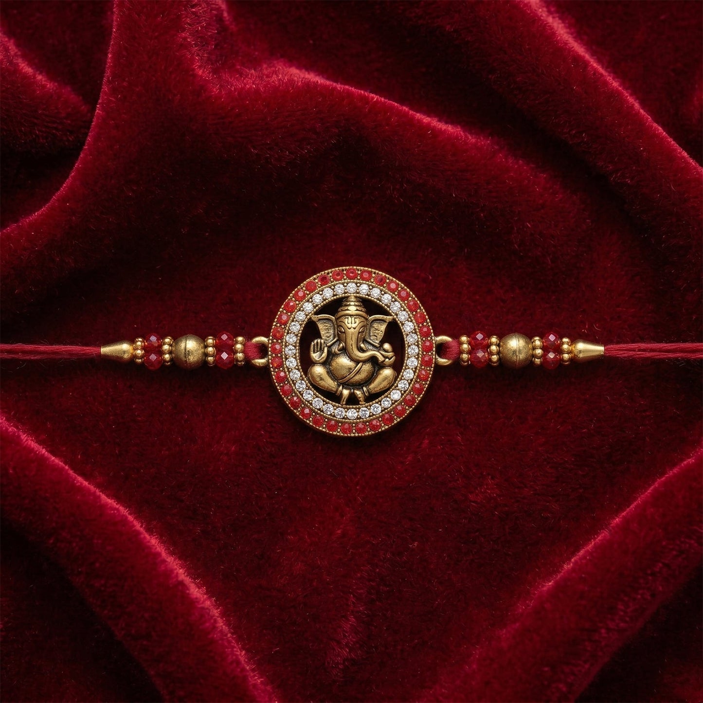 Decorative end of Golden Ganesh Rakhi with Rudraksha beads